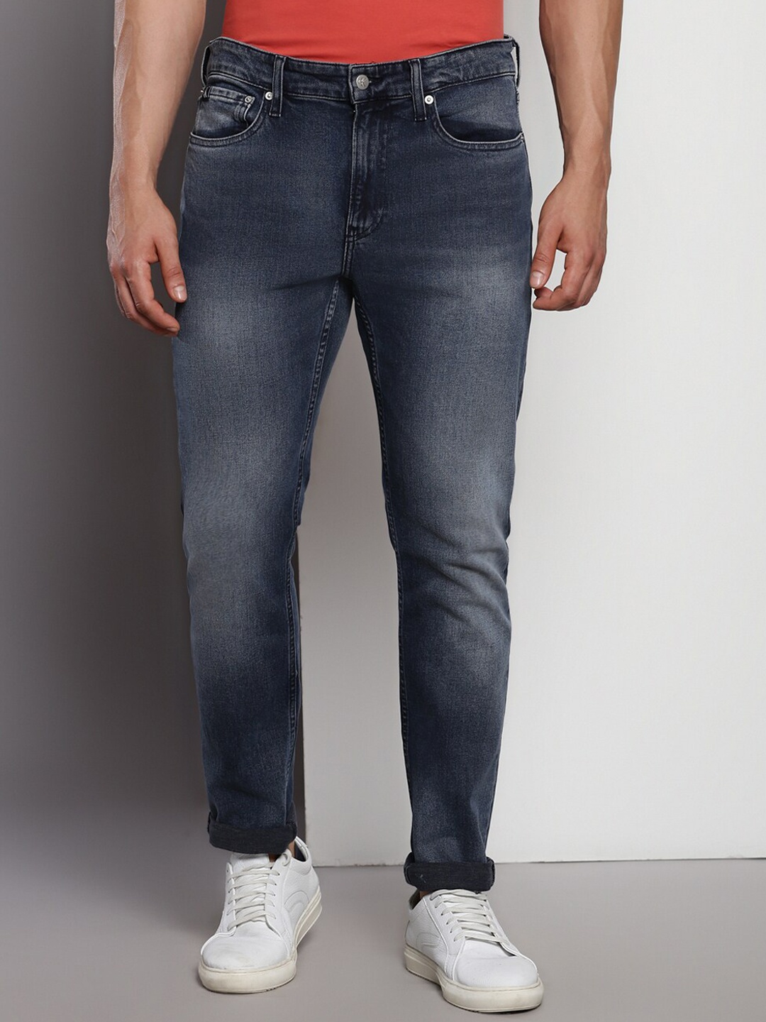 

Calvin Klein Jeans Men Mid-Rise Dark Shade Light Fade Clean Look Stretchable Jeans, Navy blue