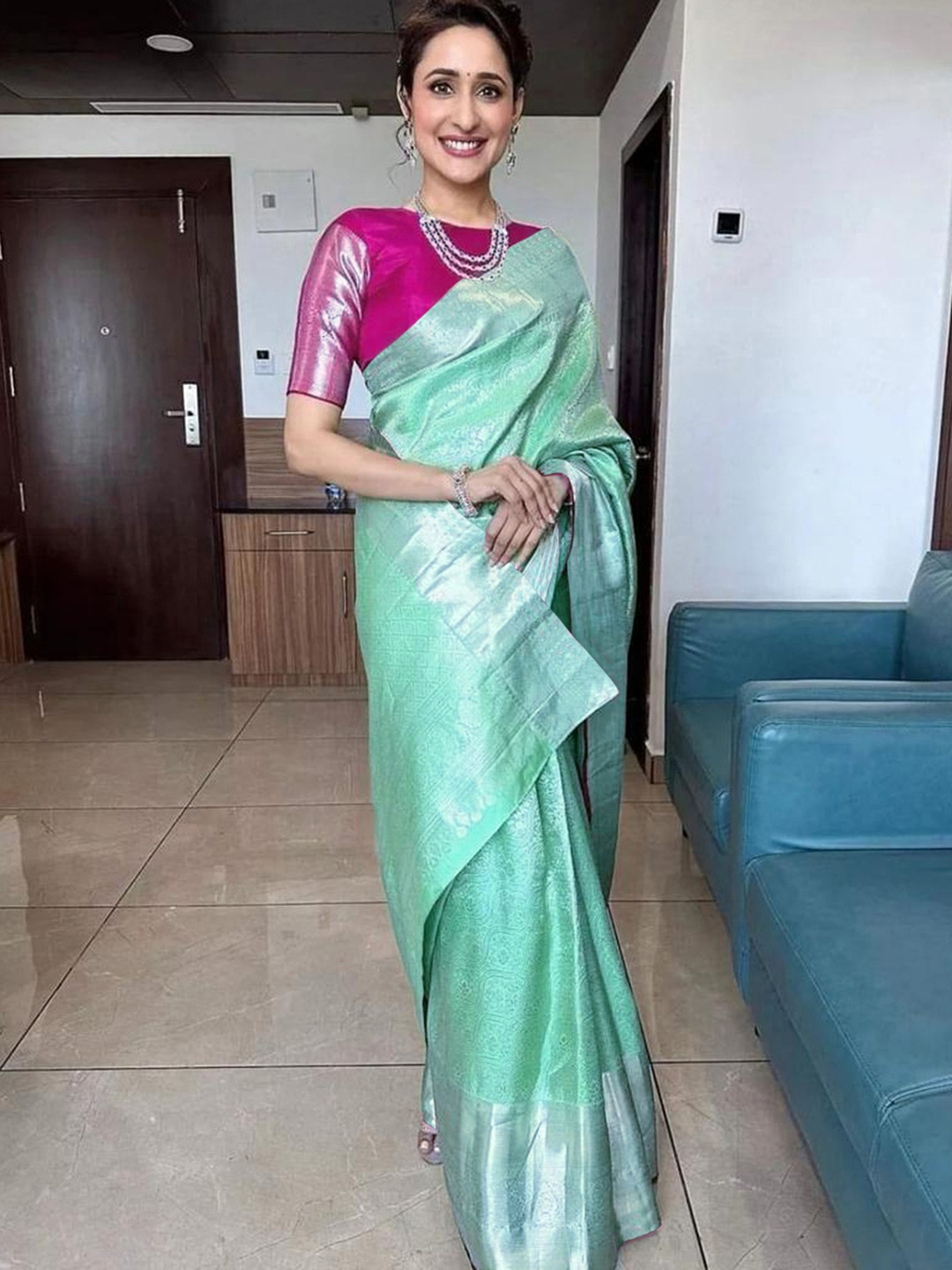 

Mitera Green & Silver Toned Ethnic Motifs Woven Design Zari Saree
