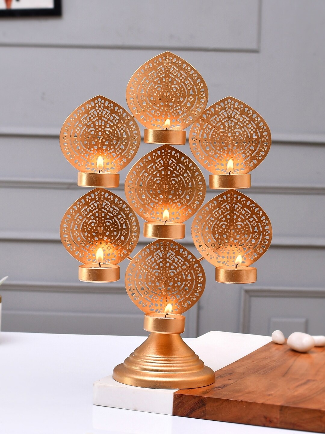 

CraftVatika Gold Toned Decoration 7 leaf Candle Holders