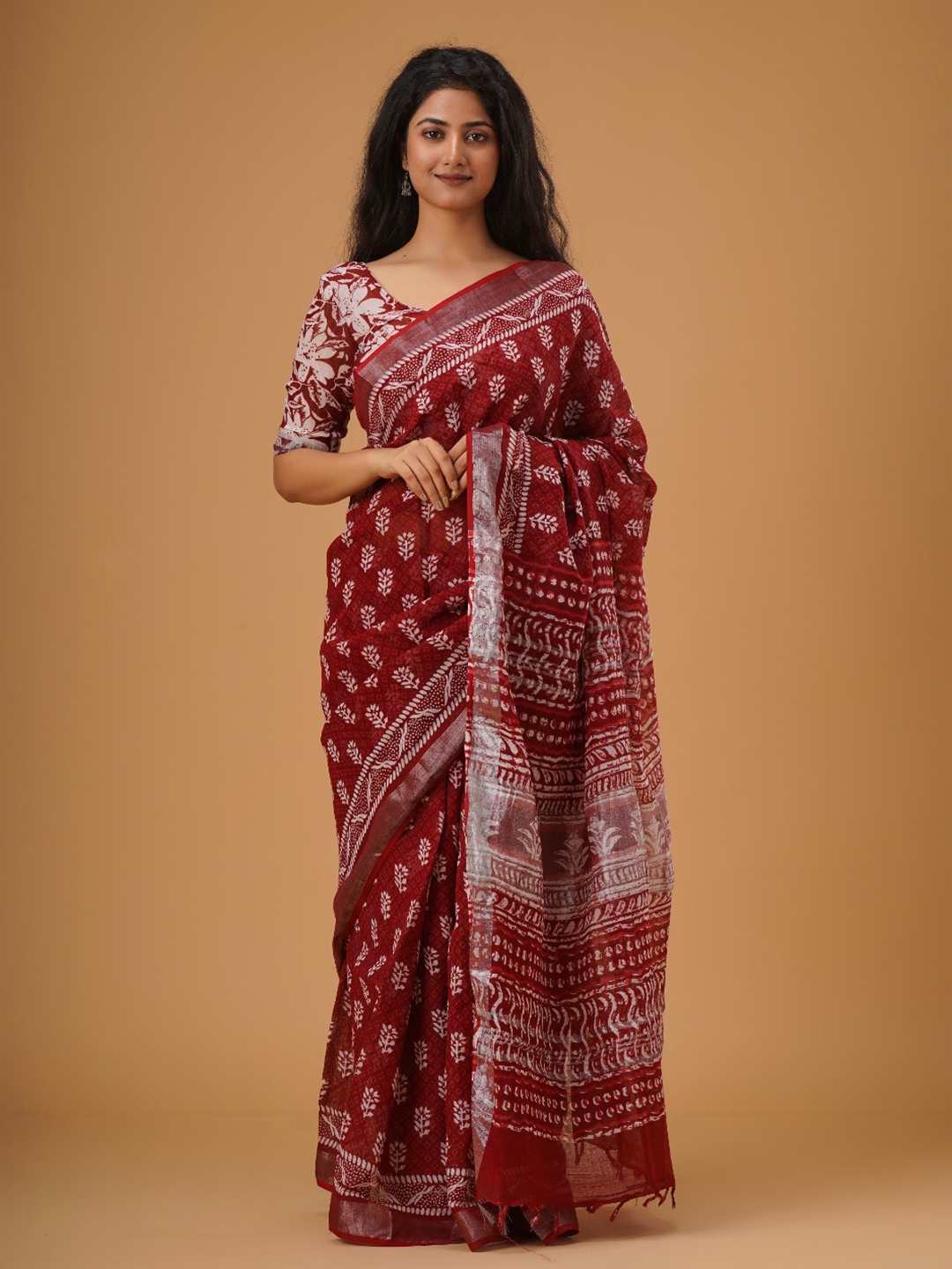 

TROPWEAR Ethnic Motifs Printed Zari Saree With Tassels, Maroon