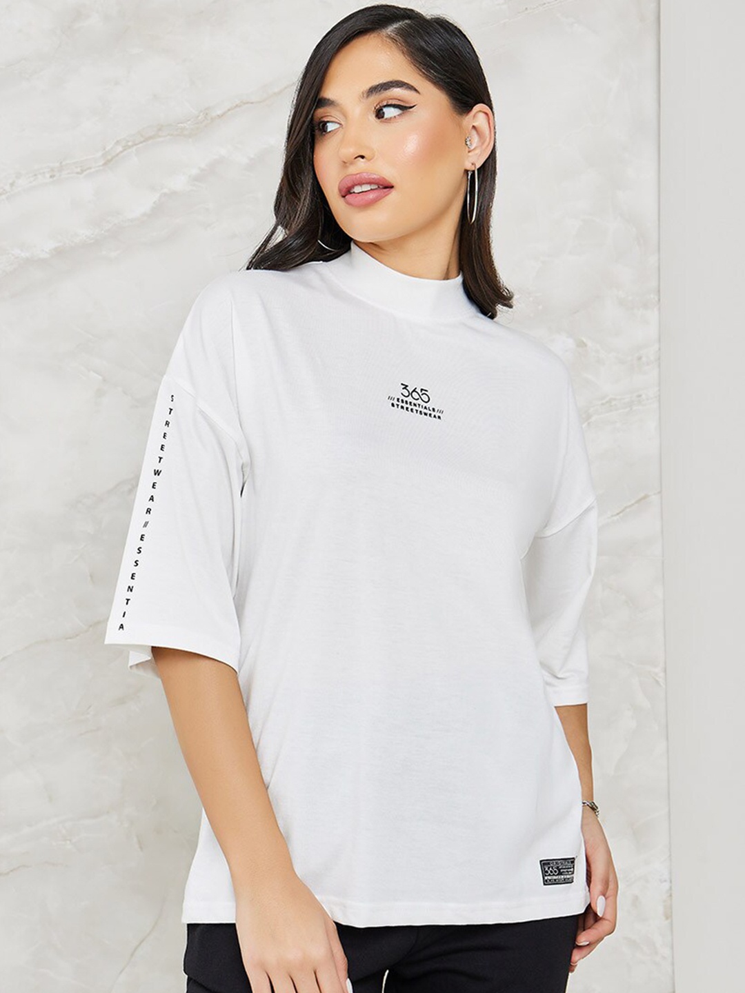 

Styli Printed High Neck Drop Shoulder Sleeves T-shirt & Flared Trouser Co-ords, White