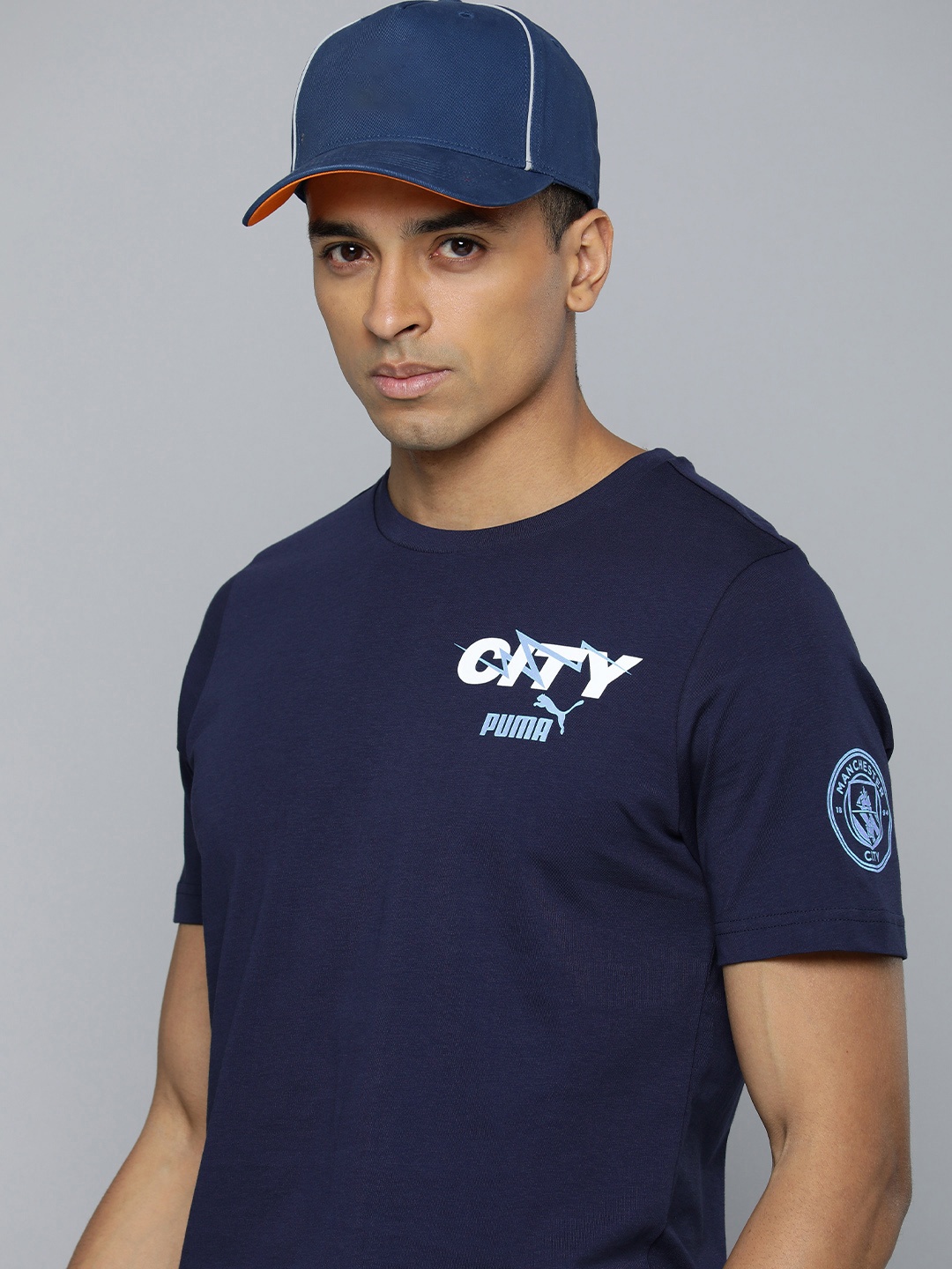 

Puma Brand Logo Manchester City Ftblicons Printed Pure Cotton Football T-shirt, Navy blue