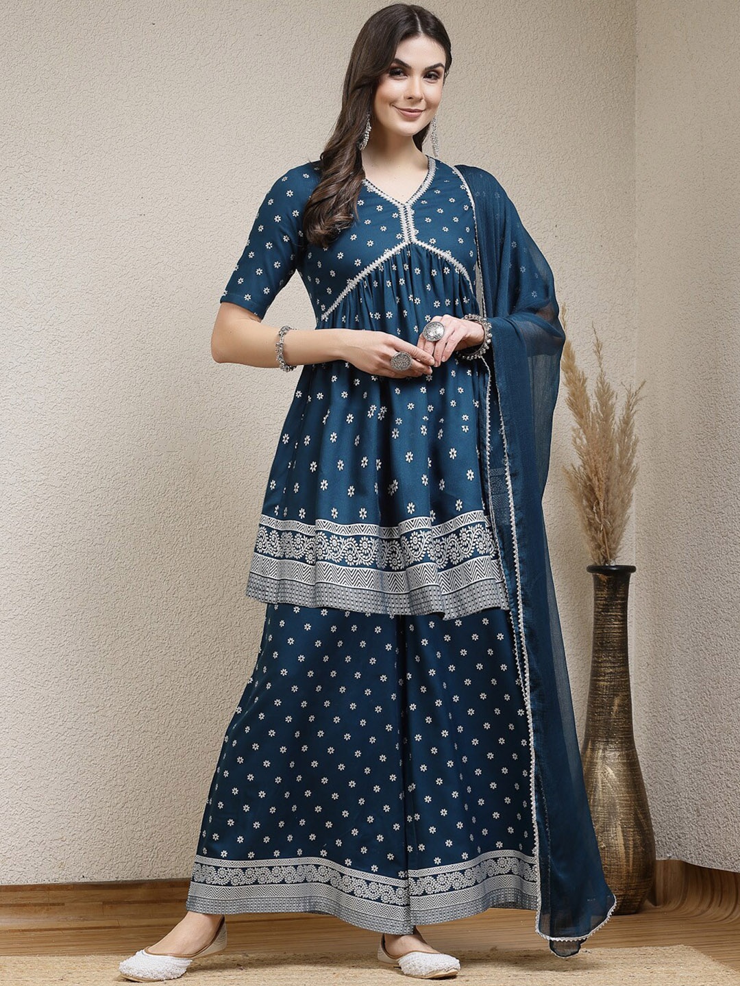 

Stylum Teal Ethnic Motifs Printed Empire Gotta Patti Anarkali Kurti with Palazzo & Dupatta