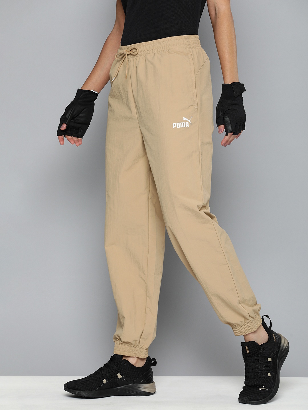 

Puma Women Woven WindCell & Water Repellent Joggers, Beige