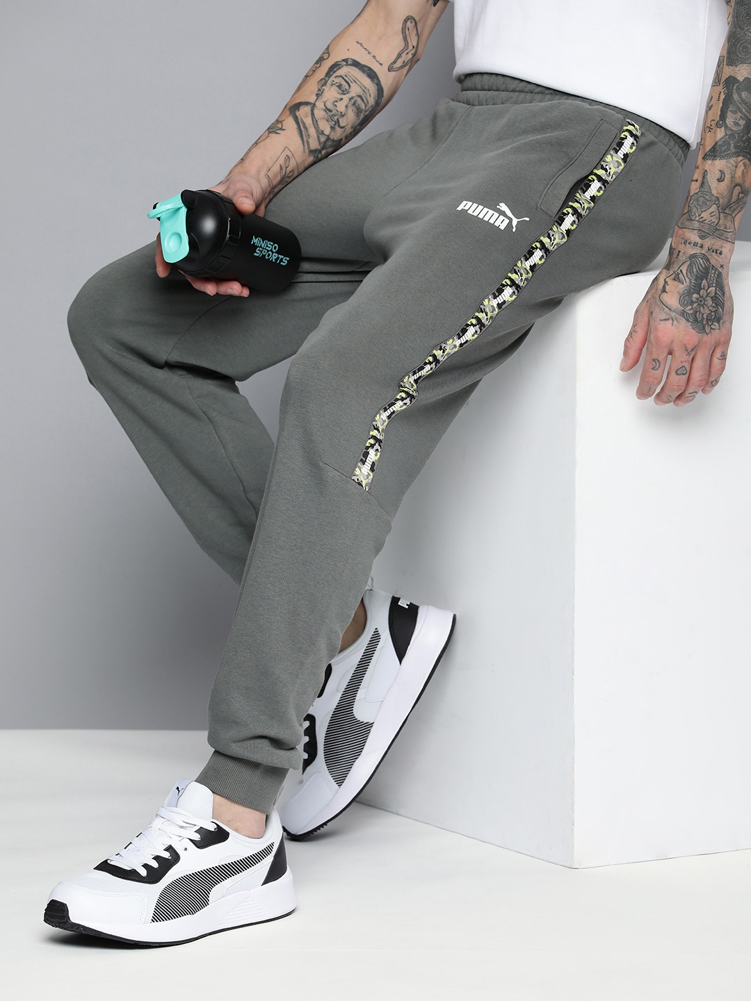 

Puma Men Mid-Rise ESS TAPE CAMO Joggers, Grey