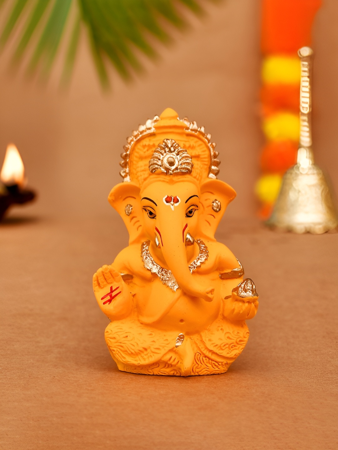 

CraftVatika Orange Small Religious Ganesha Idol Showpiece