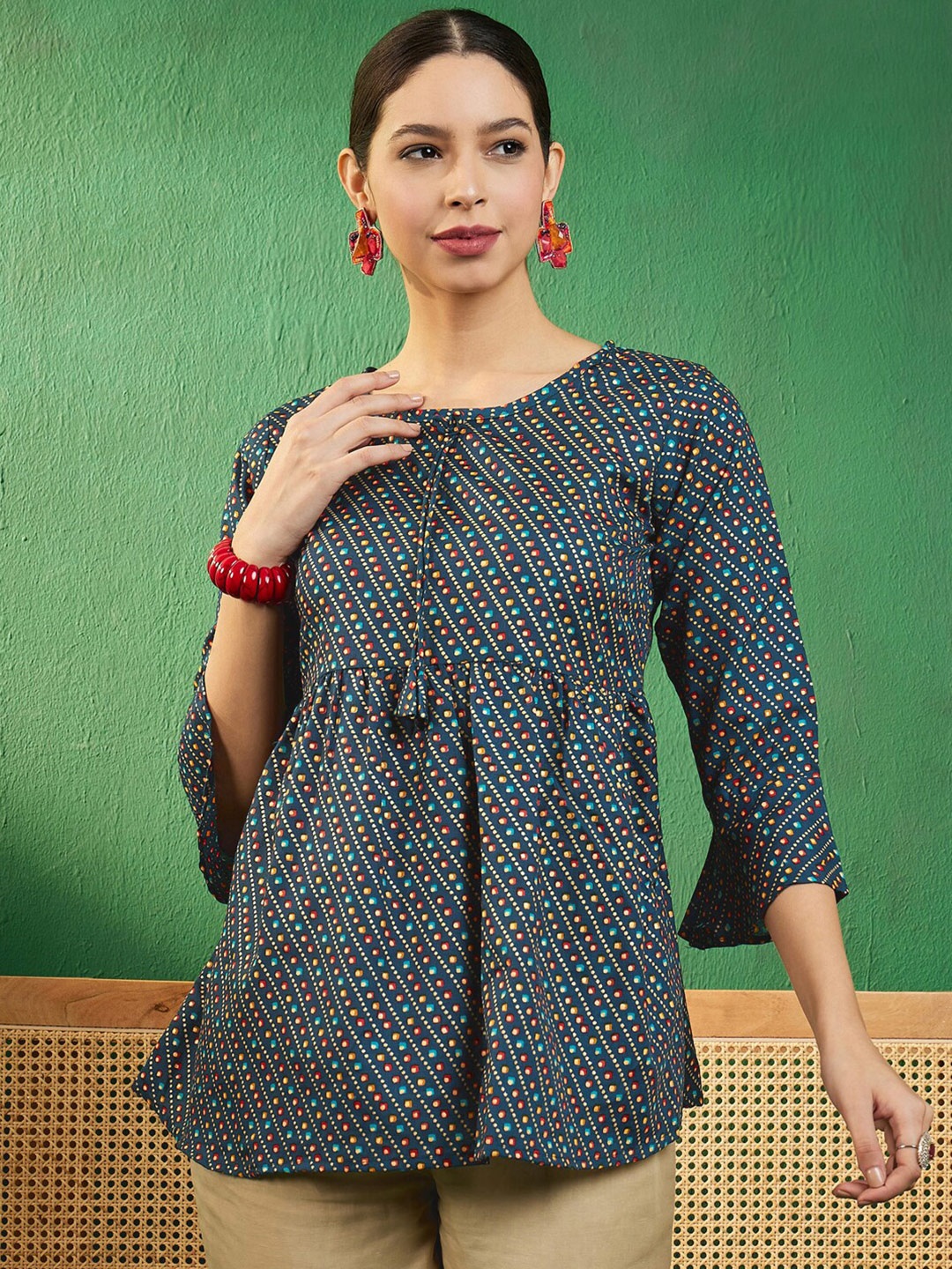 

Sangria Teal Bandhani Printed Round Neck Bell Sleeves Empire Style A-Line Kurti