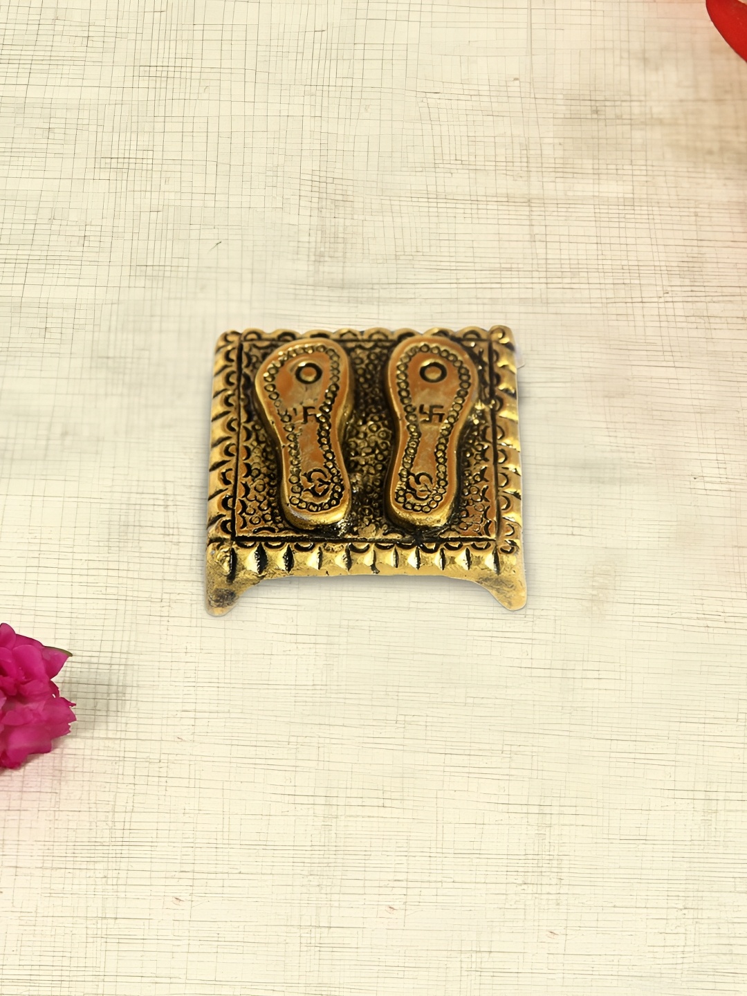 

HANDICRAFTS PARADISE Gold Toned Charan Paduka Metal Religious Idol Showpiece
