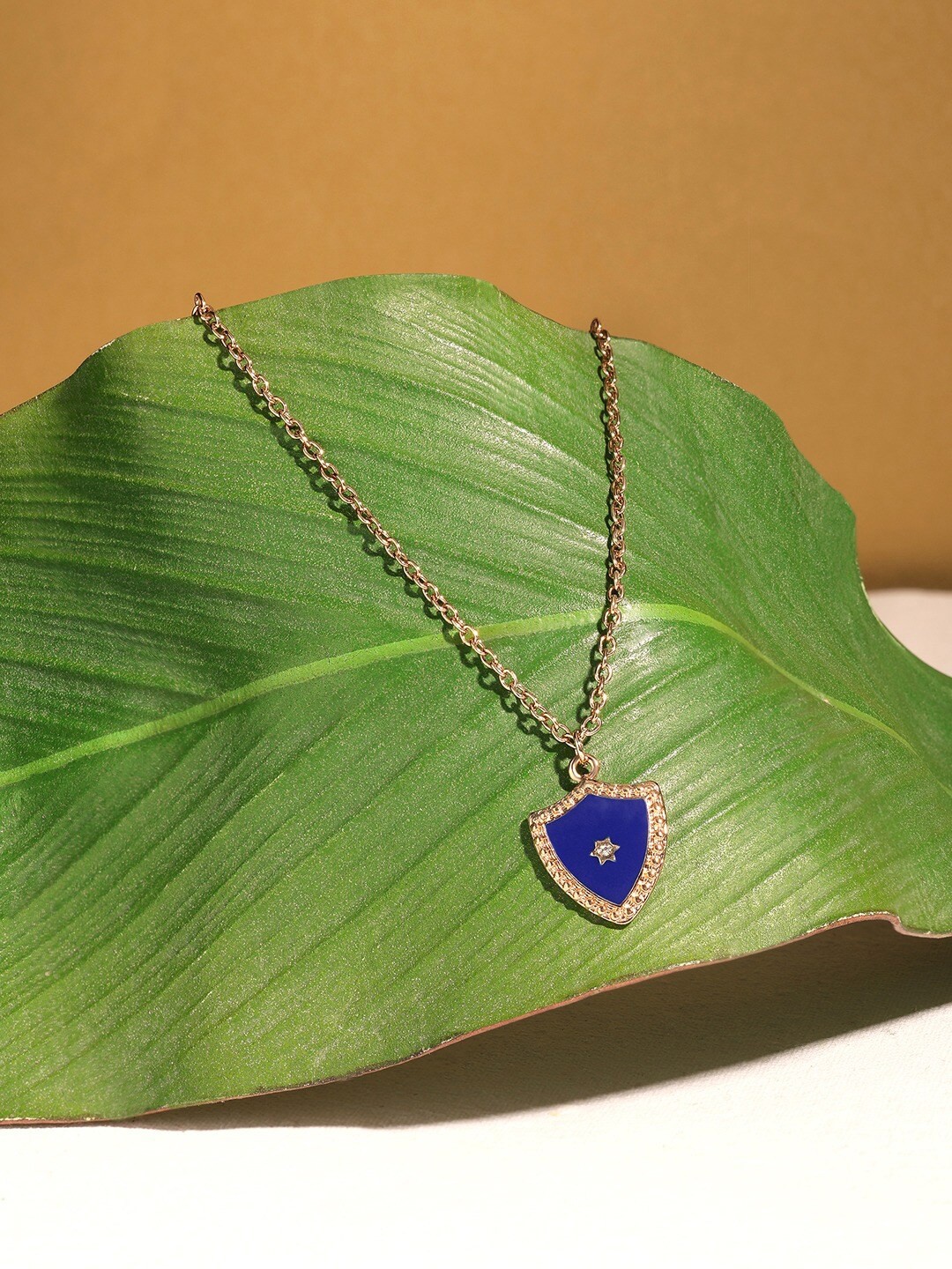 

Ami Gold-Plated Stone-Studded Pendant With Chain