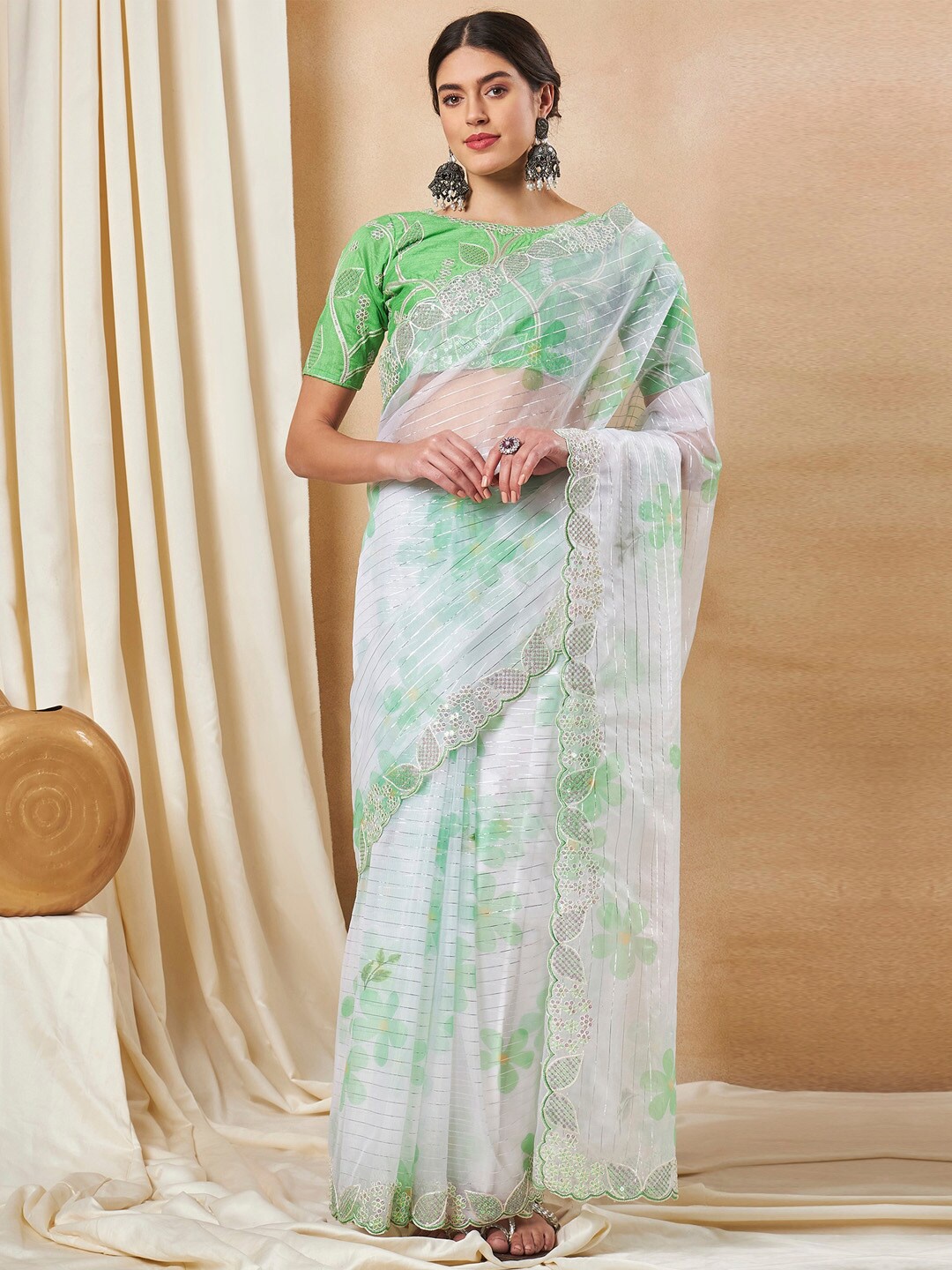 

Saree mall Green Floral Printed Sequinned Leheriya Organza Sarees