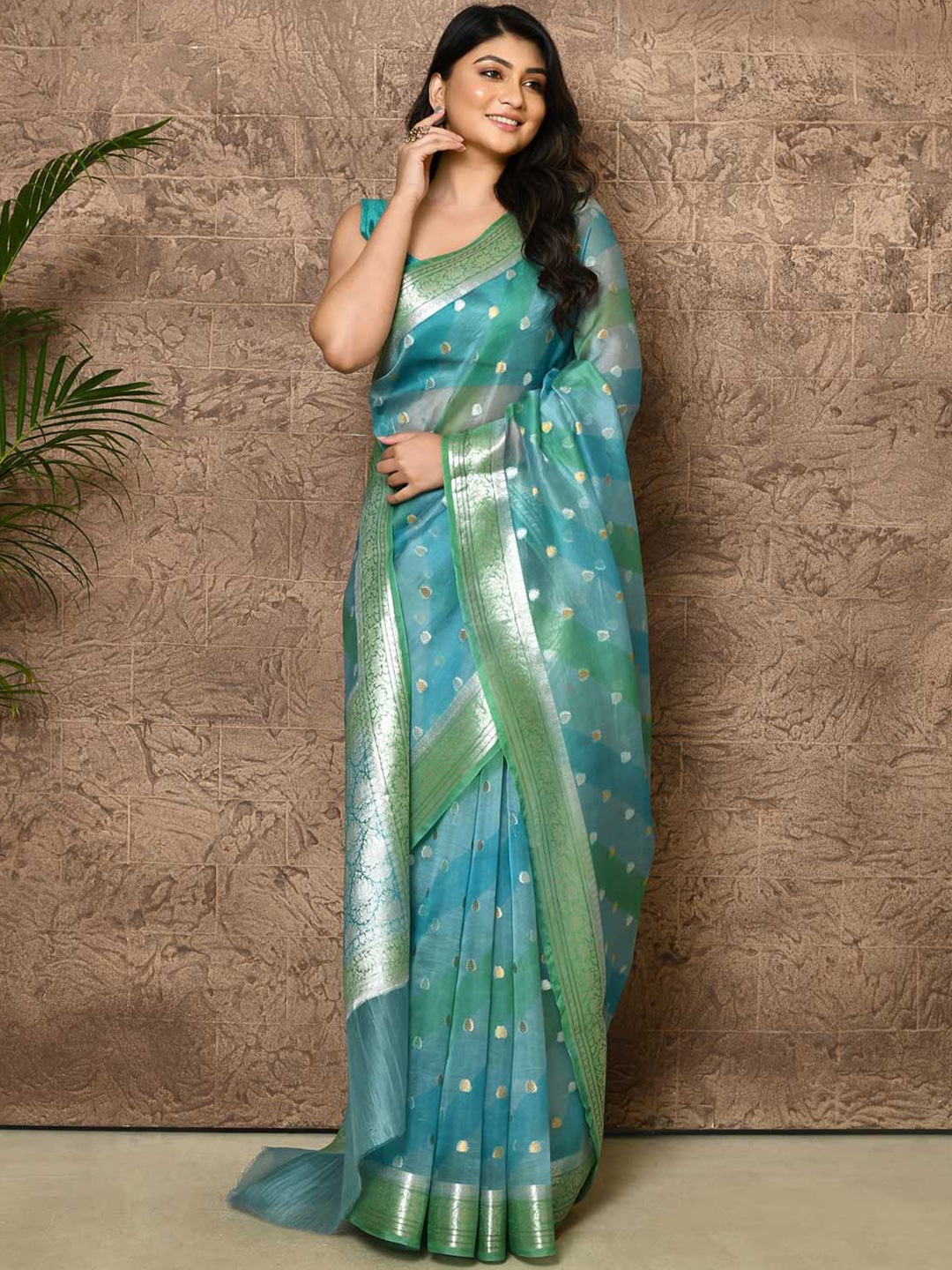

Rasm by Muskaan Ethnic Motifs Woven Design Zari Organza Banarasi Saree, Turquoise blue