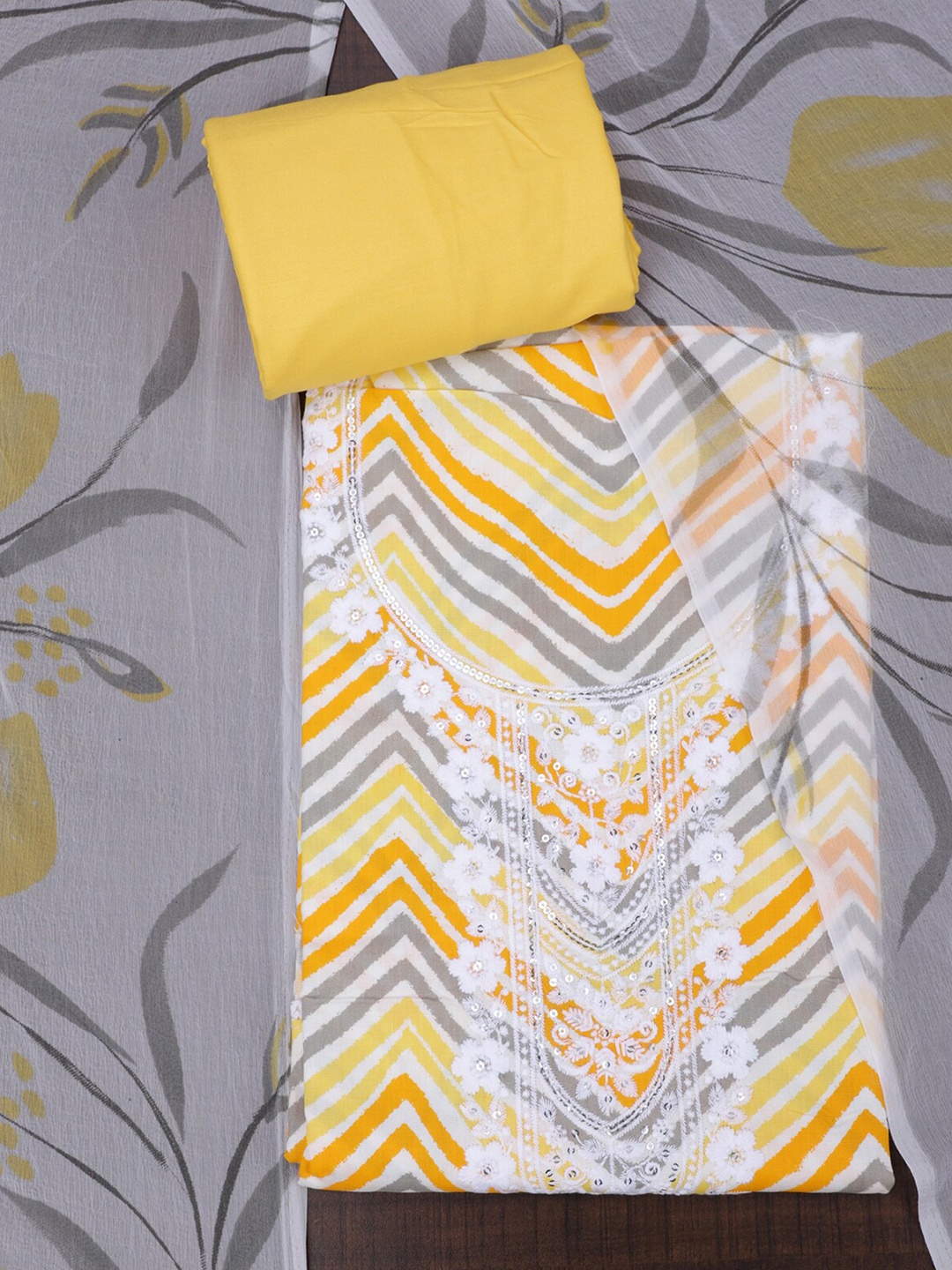 

SALWAR STUDIO Leheriya Printed Sequinned Pure Cotton Unstitched Dress Material, Yellow