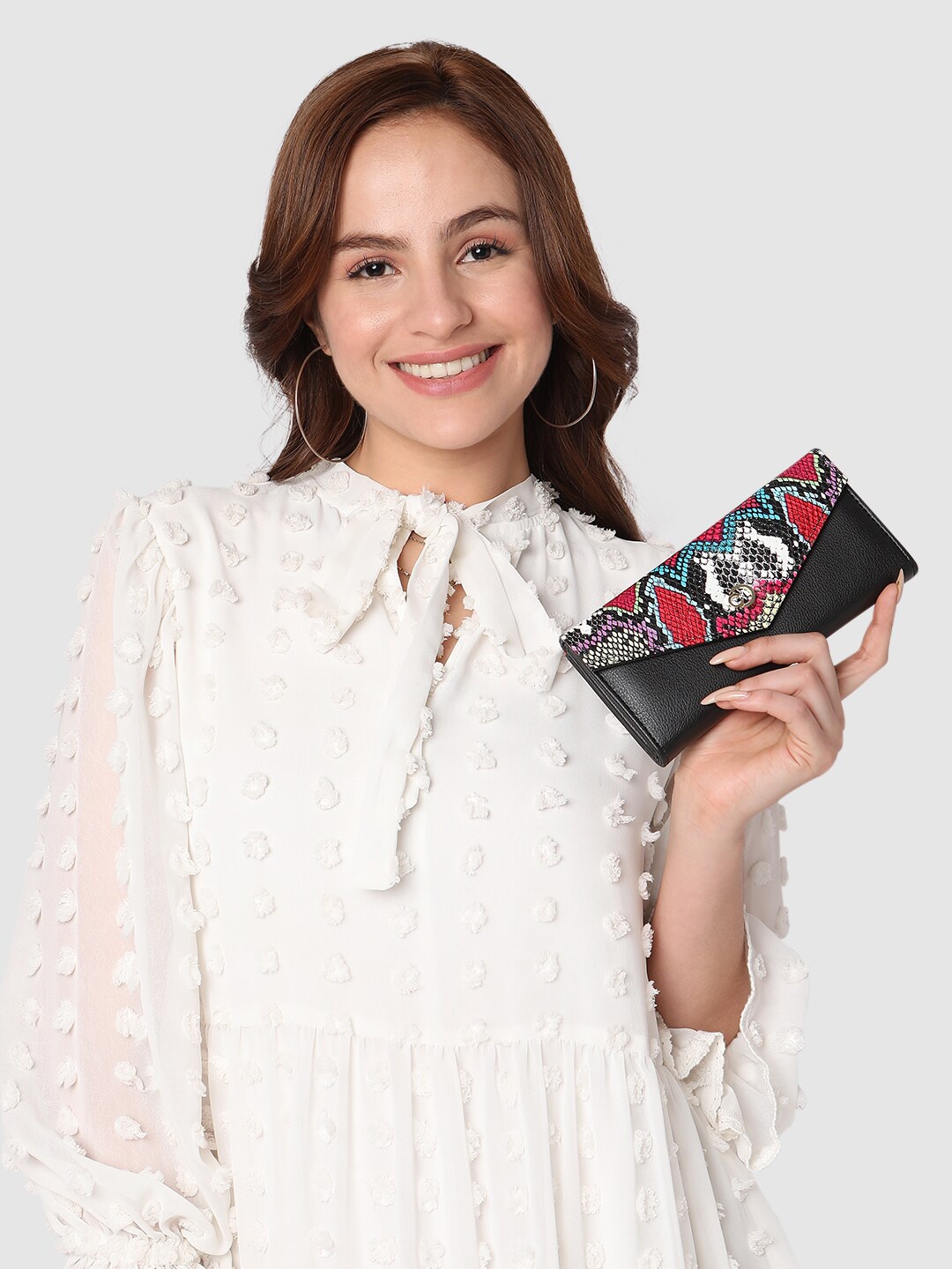 

Caprese Women Textured Three Fold Wallet, Black