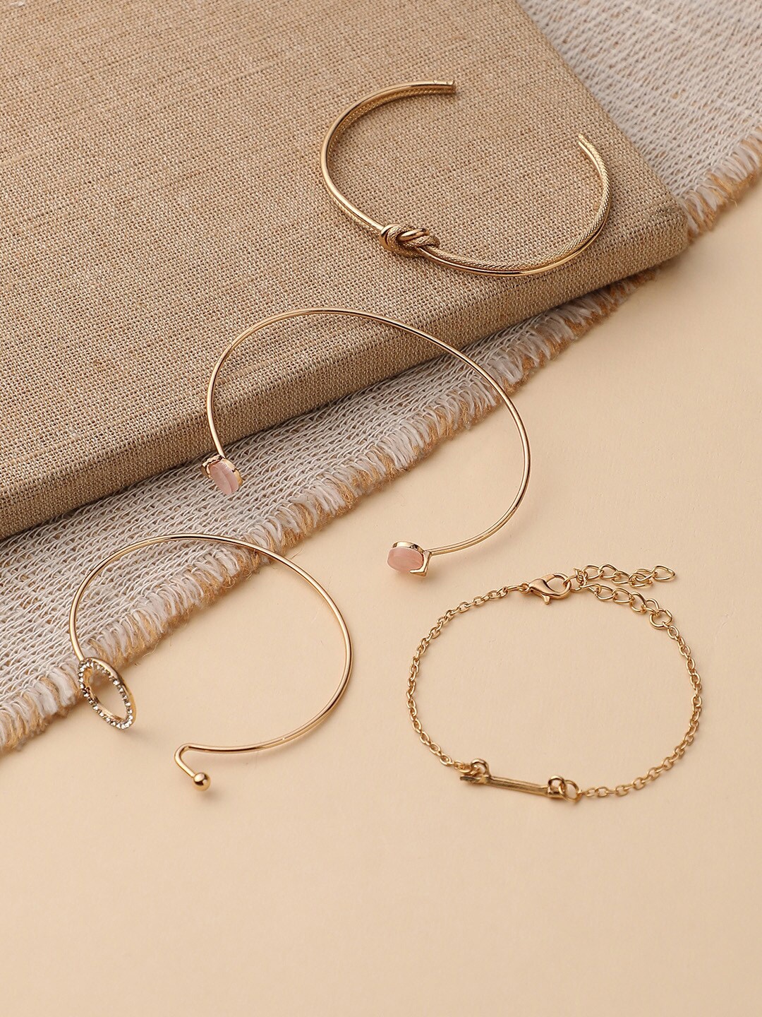 

DressBerry Set of 4 Gold-Plated Stone-Studded Cuff Bracelet