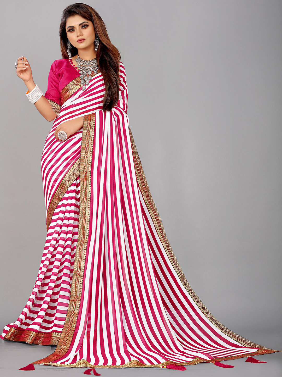 

Reeta Fashion Striped Zari Pure Georgette Saree, Pink