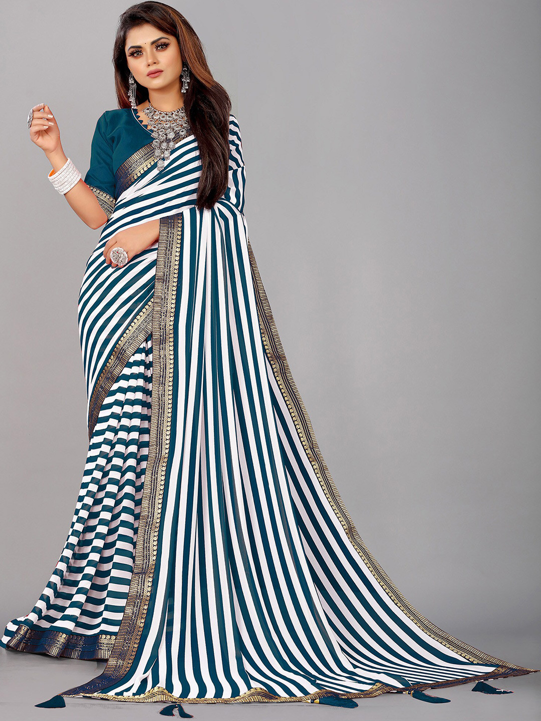 

Reeta Fashion Striped Zari Pure Georgette Saree, Turquoise blue