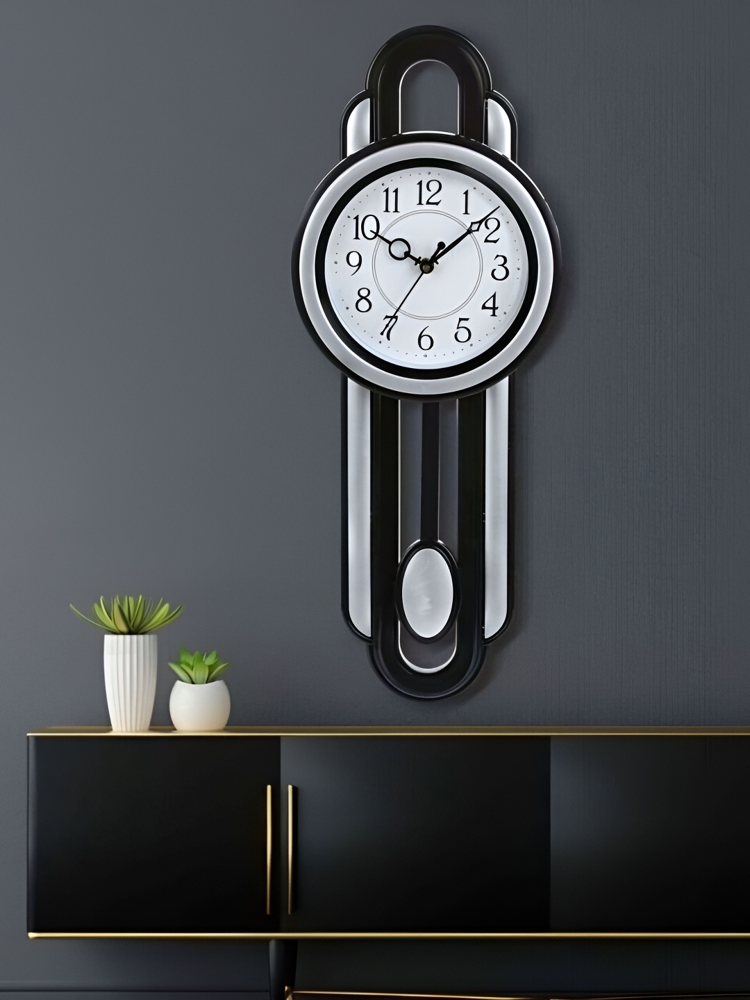 

Attractionz Silver Toned & Black Round Shaped Pendulum Contemporary Analogue Wall Clock