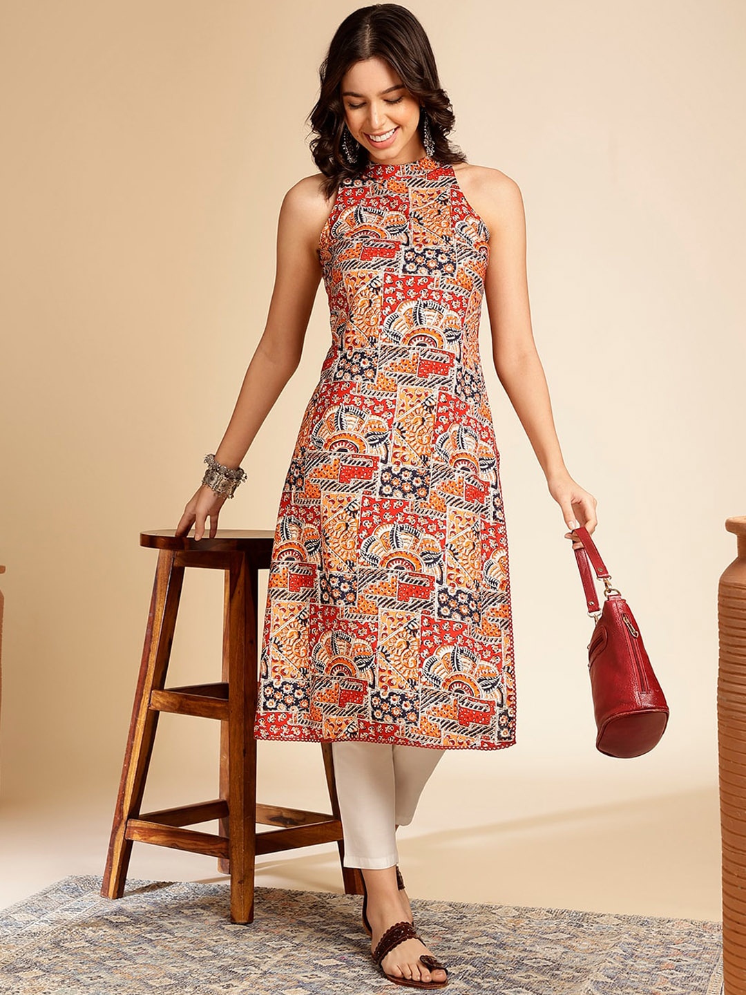 

Anouk Geometric Printed Halter Neck Straight Kurta, Orange
