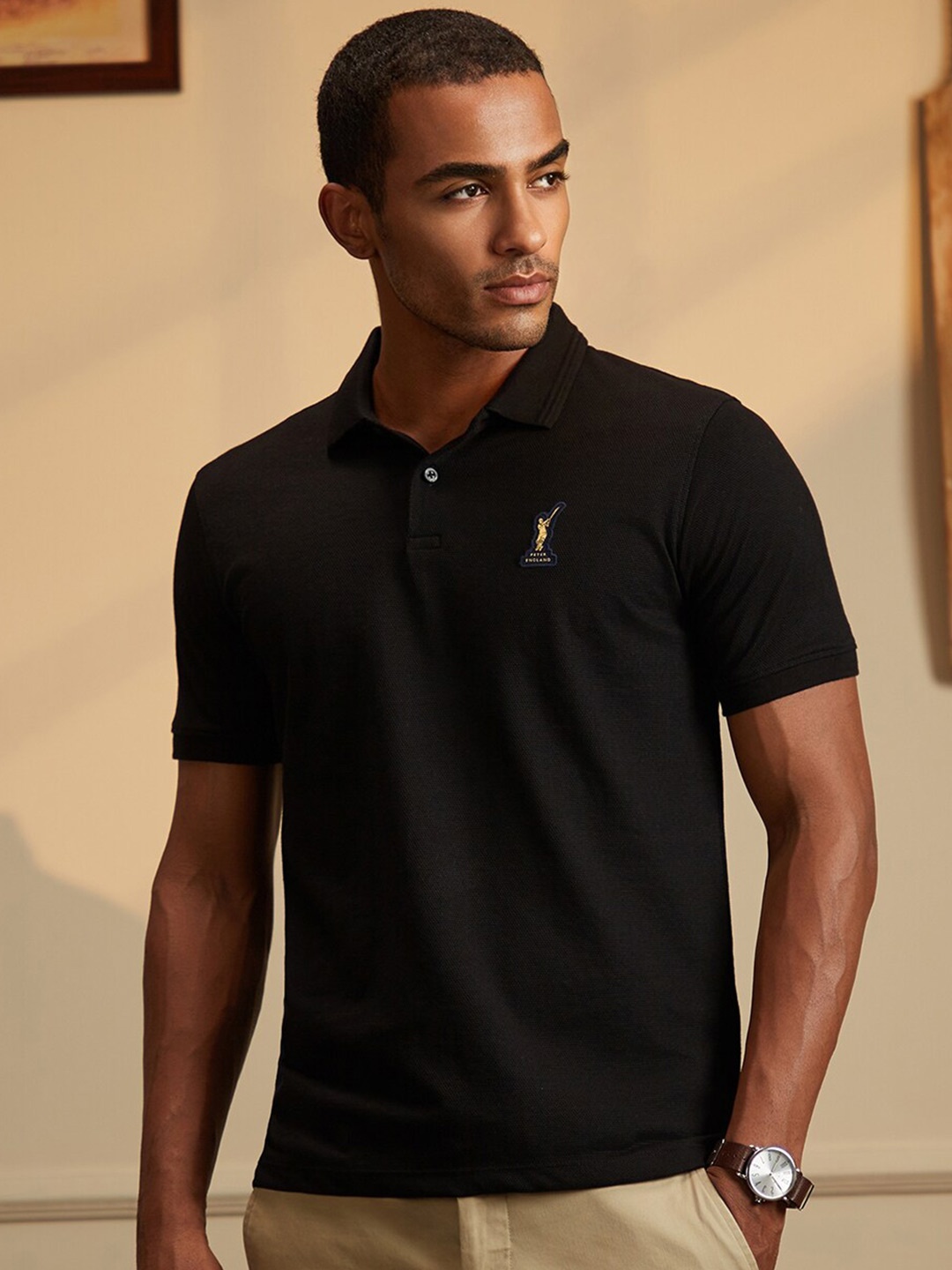 

Peter England CasualsMen Regular fit cricket inspired Polo T-shirt, Black
