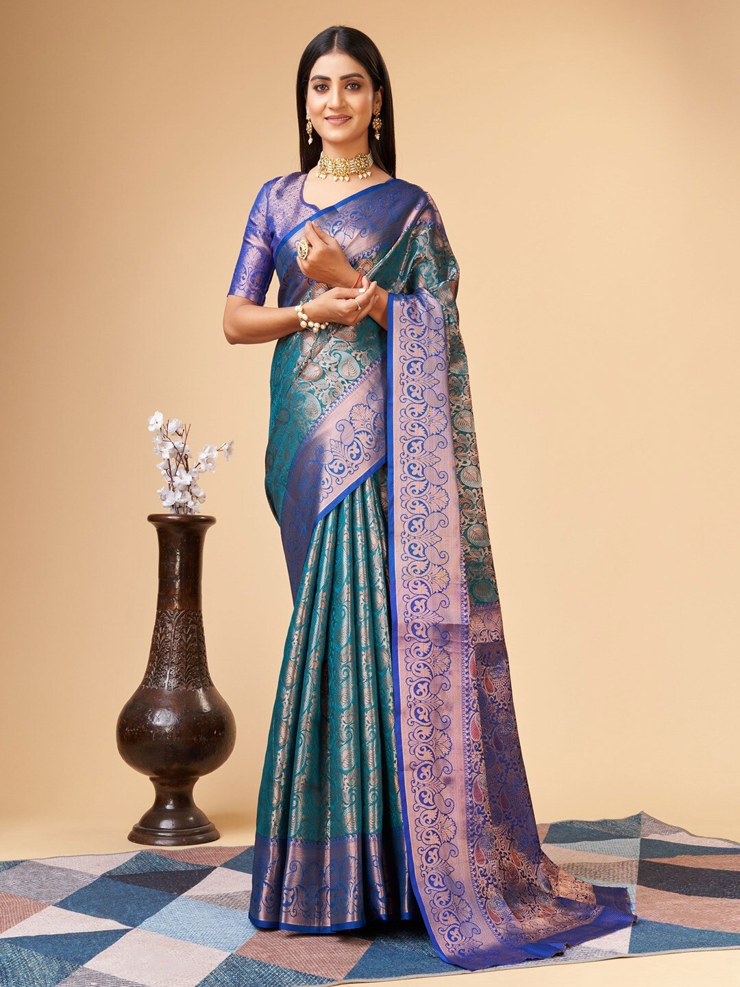 

Vilochan Woven Design Teal Lichi Silk Saree
