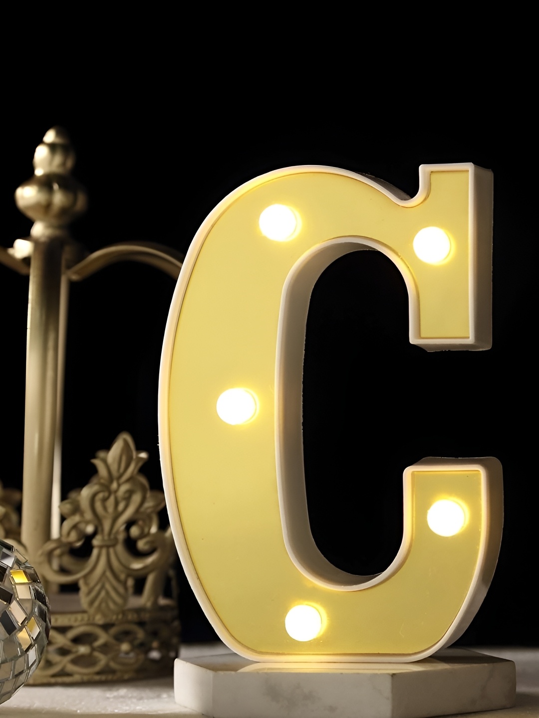 

Satyam Kraft Gold-Toned Abstract Acrylic Alphabet Shaped Contemporary Table Lamp