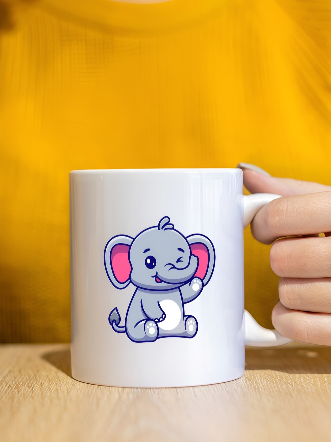 

The Decor Lane White & Pink Baby Elephant Printed Ceramic Glossy Mug 325 ml