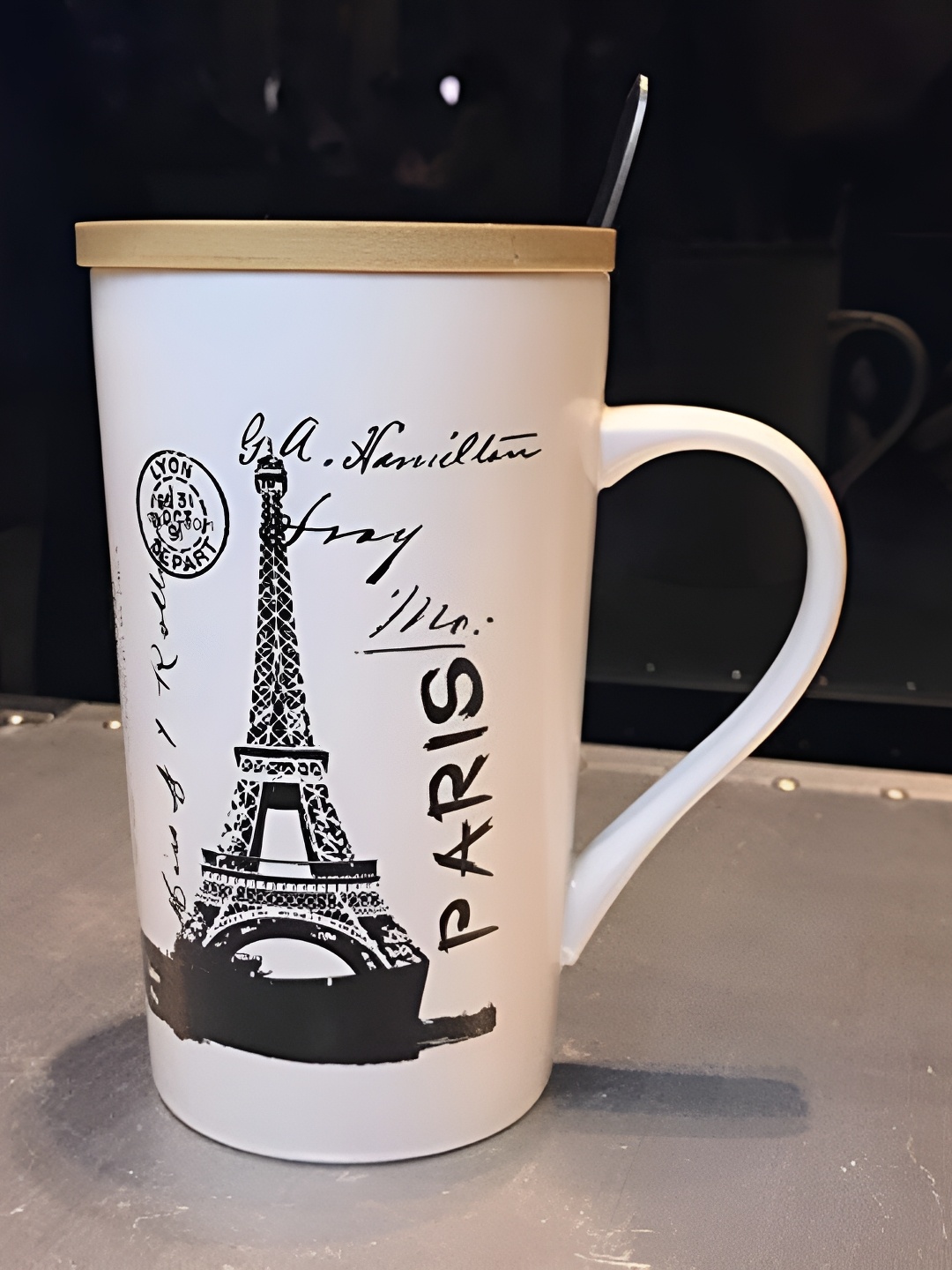 

Satyam Kraft 1 Pc Paris City Printed Ceramic Coffee Mug with Wooden Lid & Spoon, White
