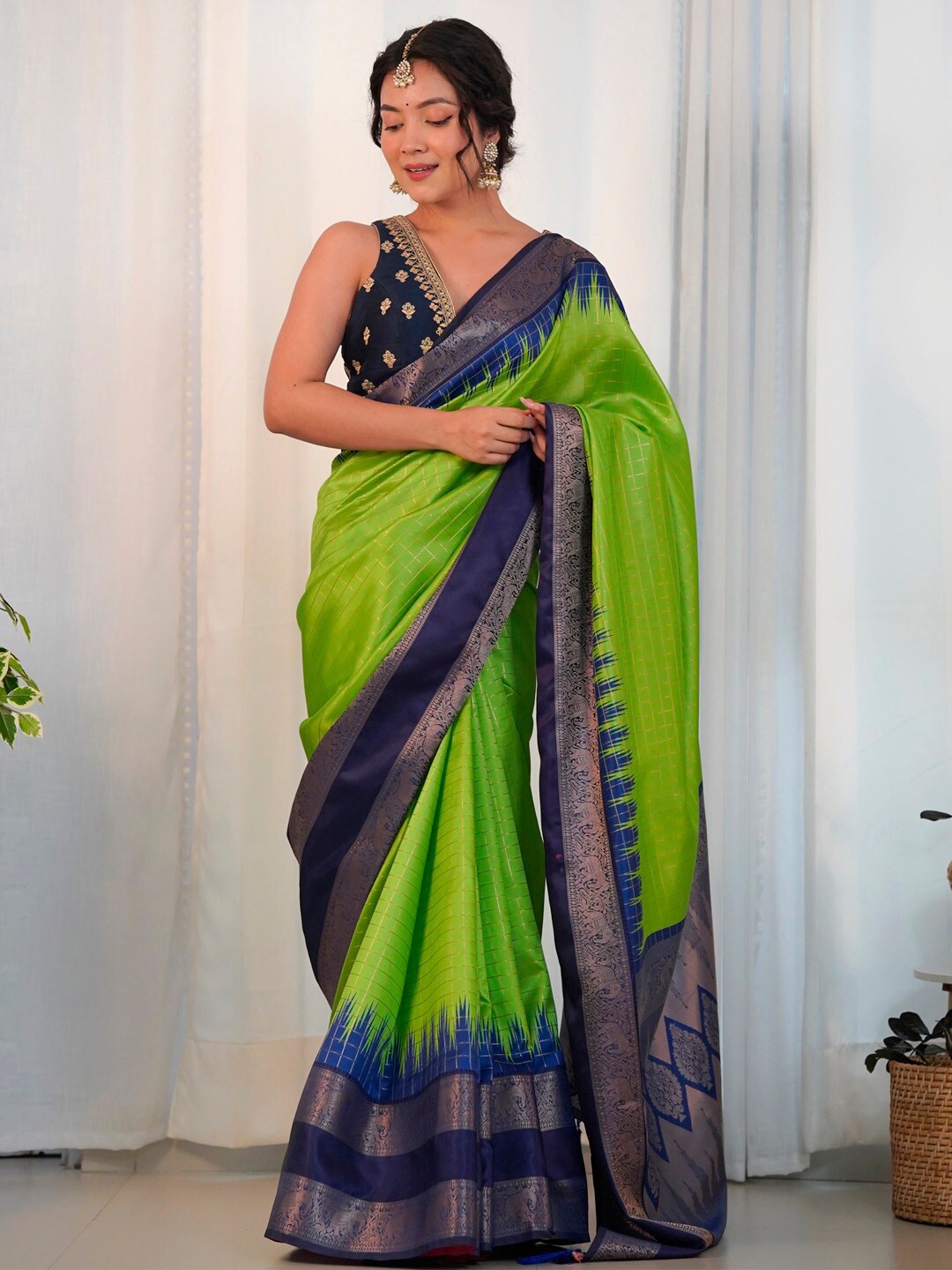 

Saree mall Green Checked Woven Design Zari Saree