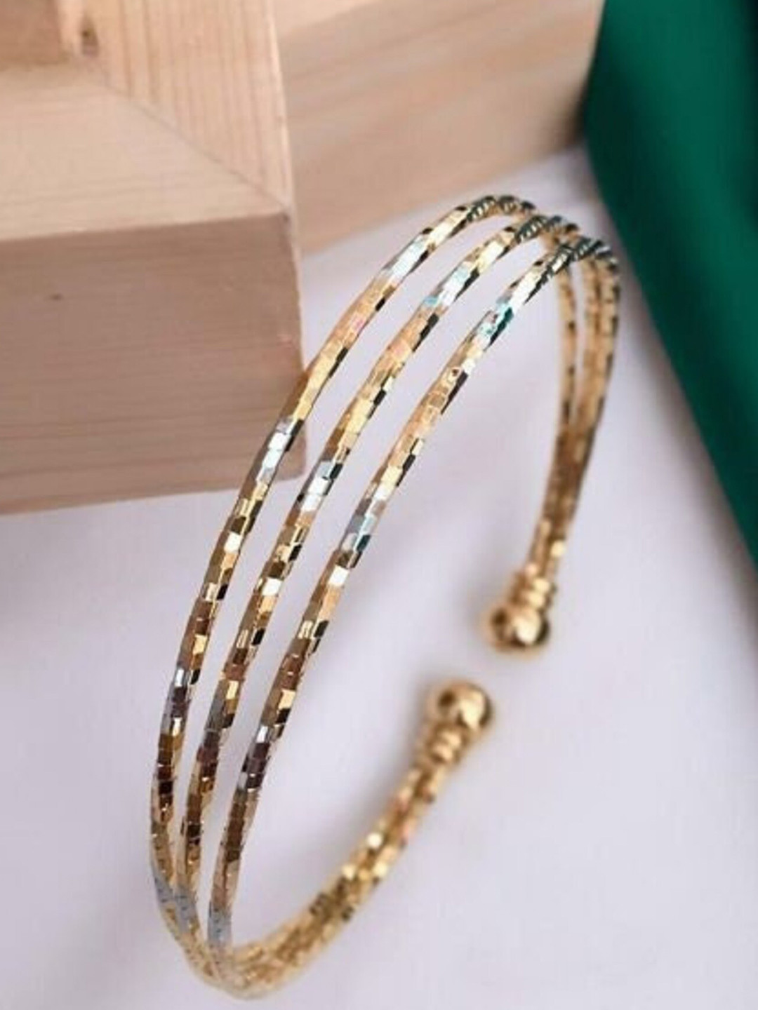 

The Pari Stainless Steel Gold Plated adjustable Cuff Bracelet