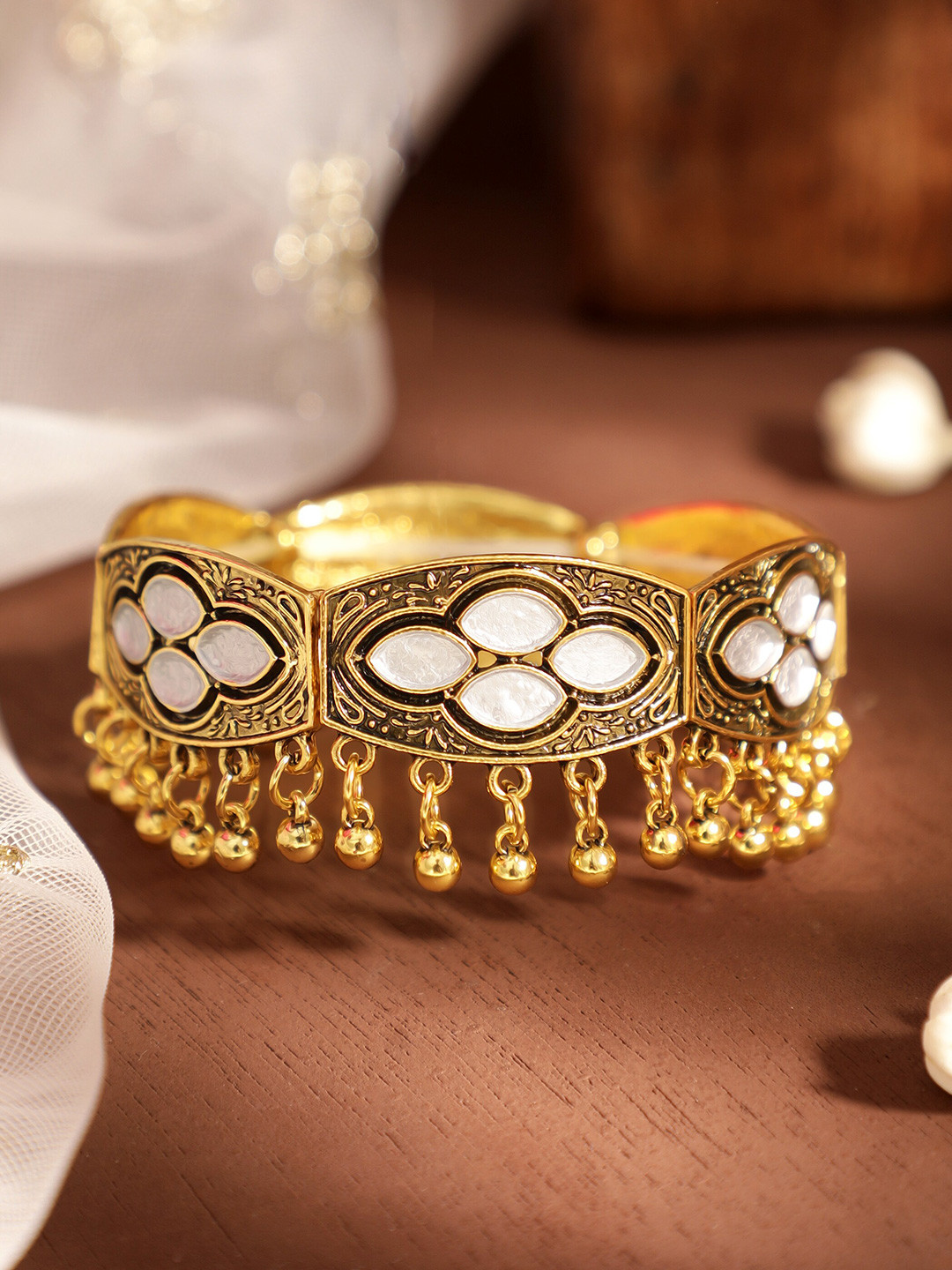 

Rubans 18K Gold Plated White Kundan Studded & Gold Ghungroo Beads Antique Design Bracelet