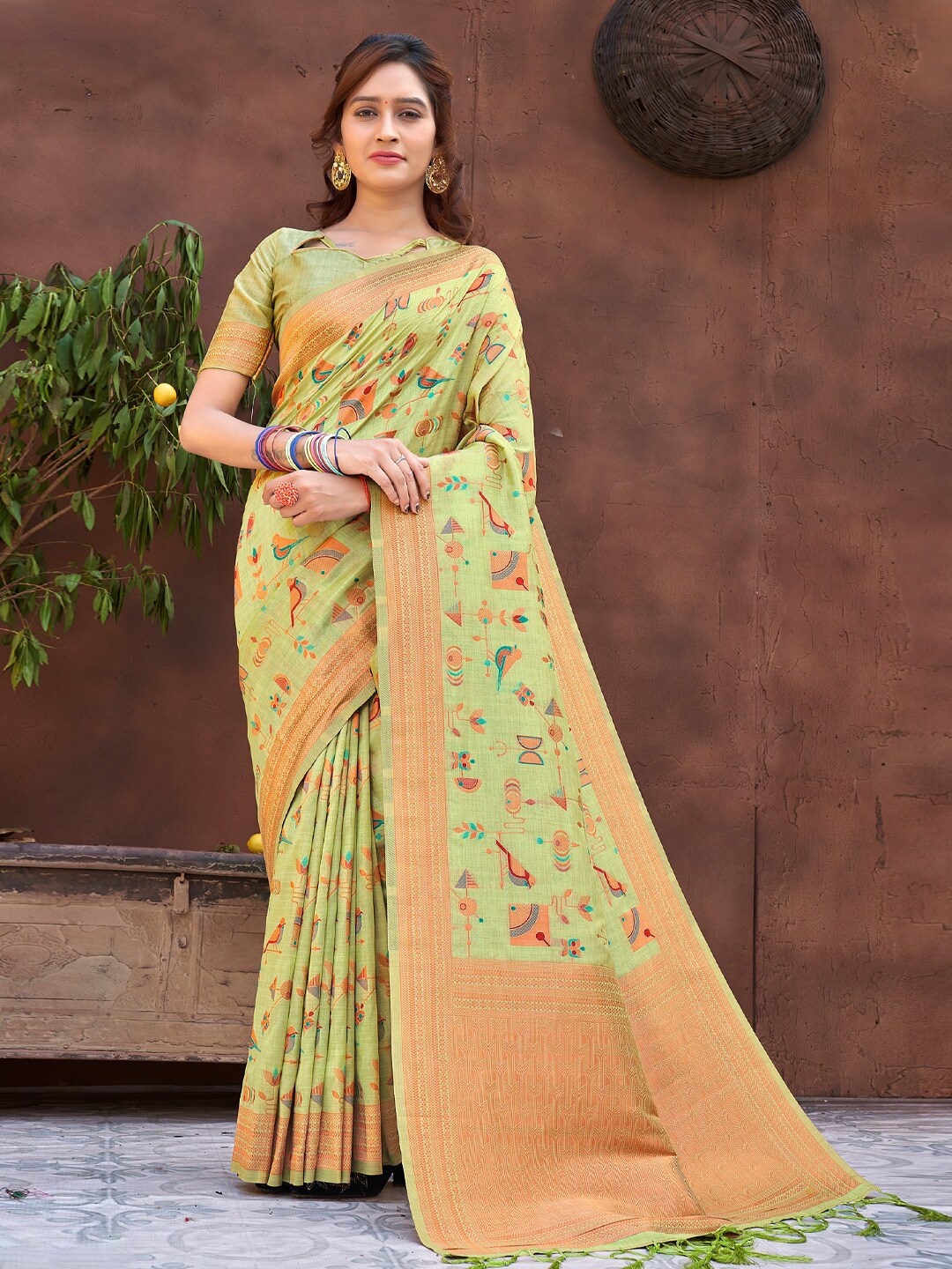 

Mitera Green Ethnic Motifs Embroidered Zari Saree