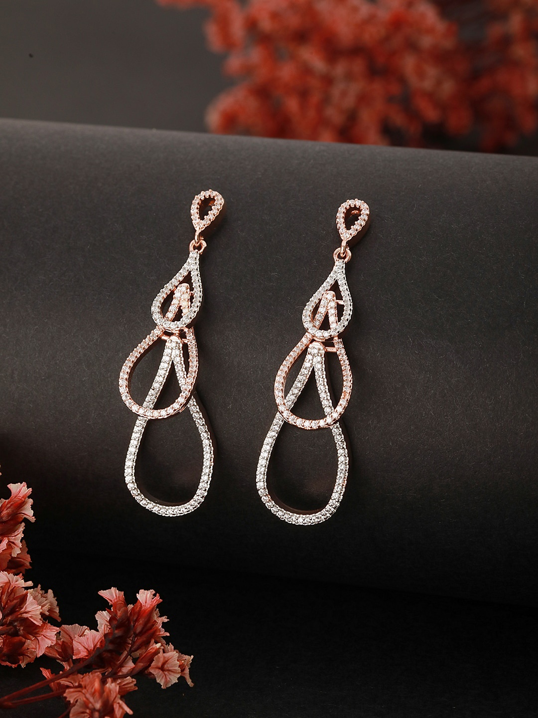 

Saraf RS Jewellery Rose Gold Plated Contemporary American Diamond Drop Earrings