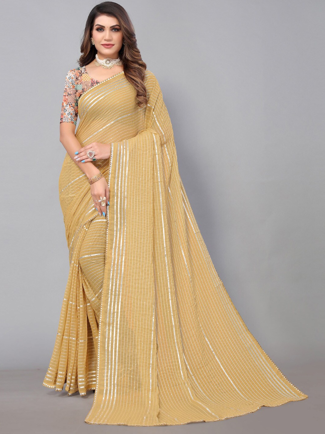 

Shaily Cream Striped Embellished Zari Saree