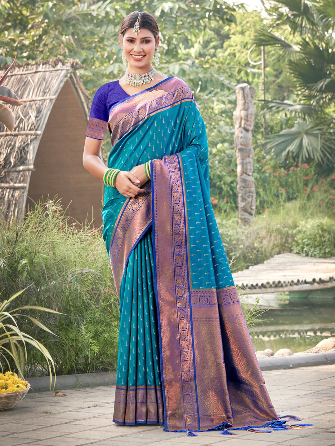 

Mitera Blue & Copper Polka Dot Woven Design Zari Banarasi Saree