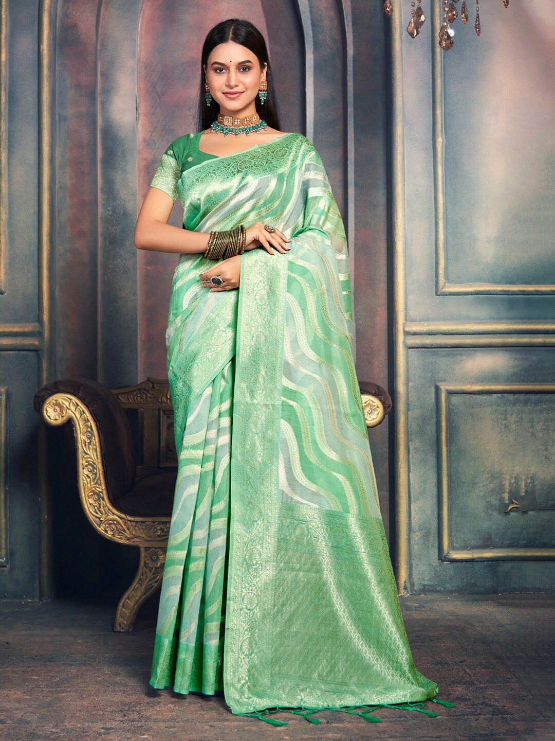 

Mitera Green Ethnic Motifs Woven Design Zari Saree