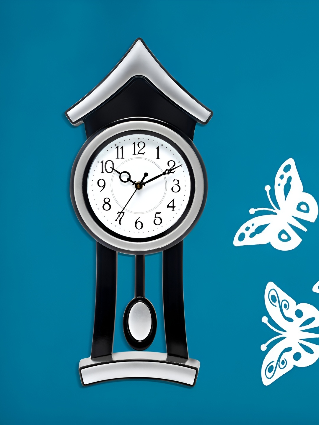 

Attractionz Silver-Toned & White Round Shaped Contemporary Pendulum Analogue Wall Clock
