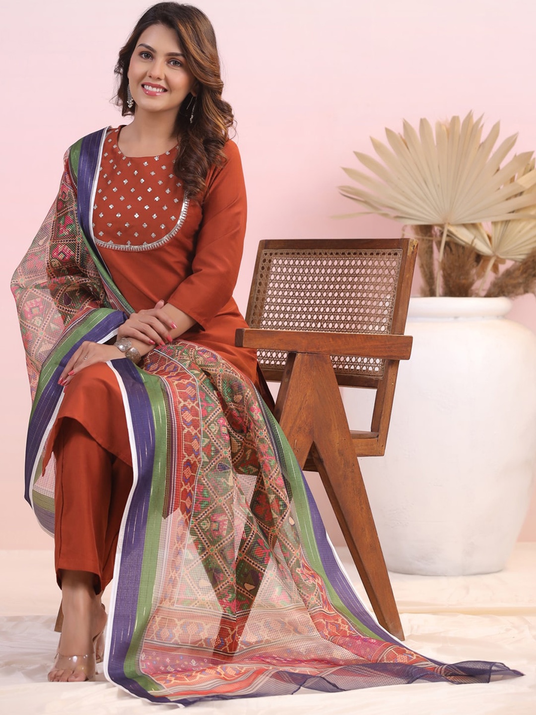 

Sangria Rust Ethnic Motifs Yoke Design Sequinned Round Neck Kurta With Trousers & Dupatta