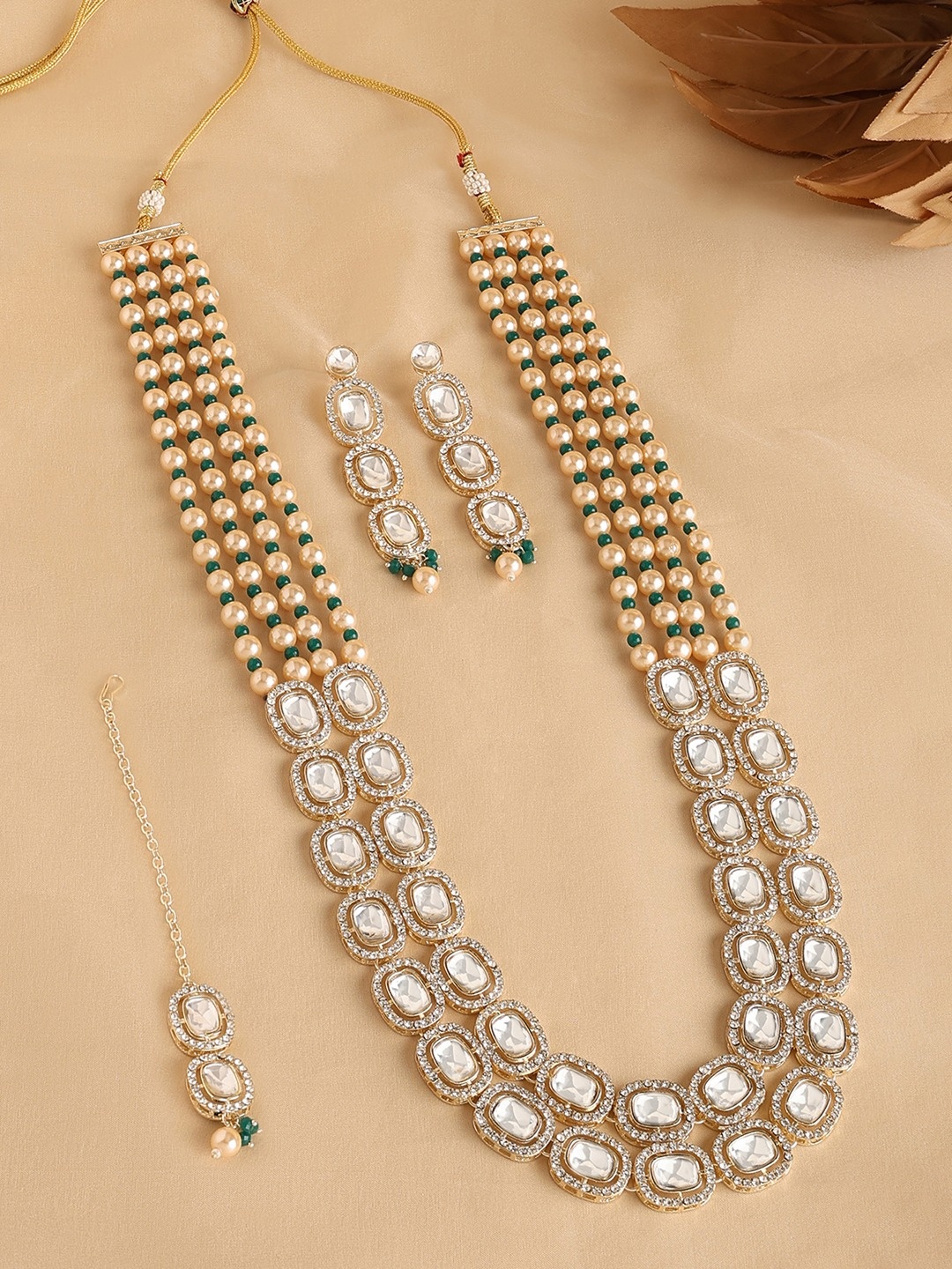 

Zaveri Pearls Gold Plated Kundan Studded & Beaded Jewellery Set