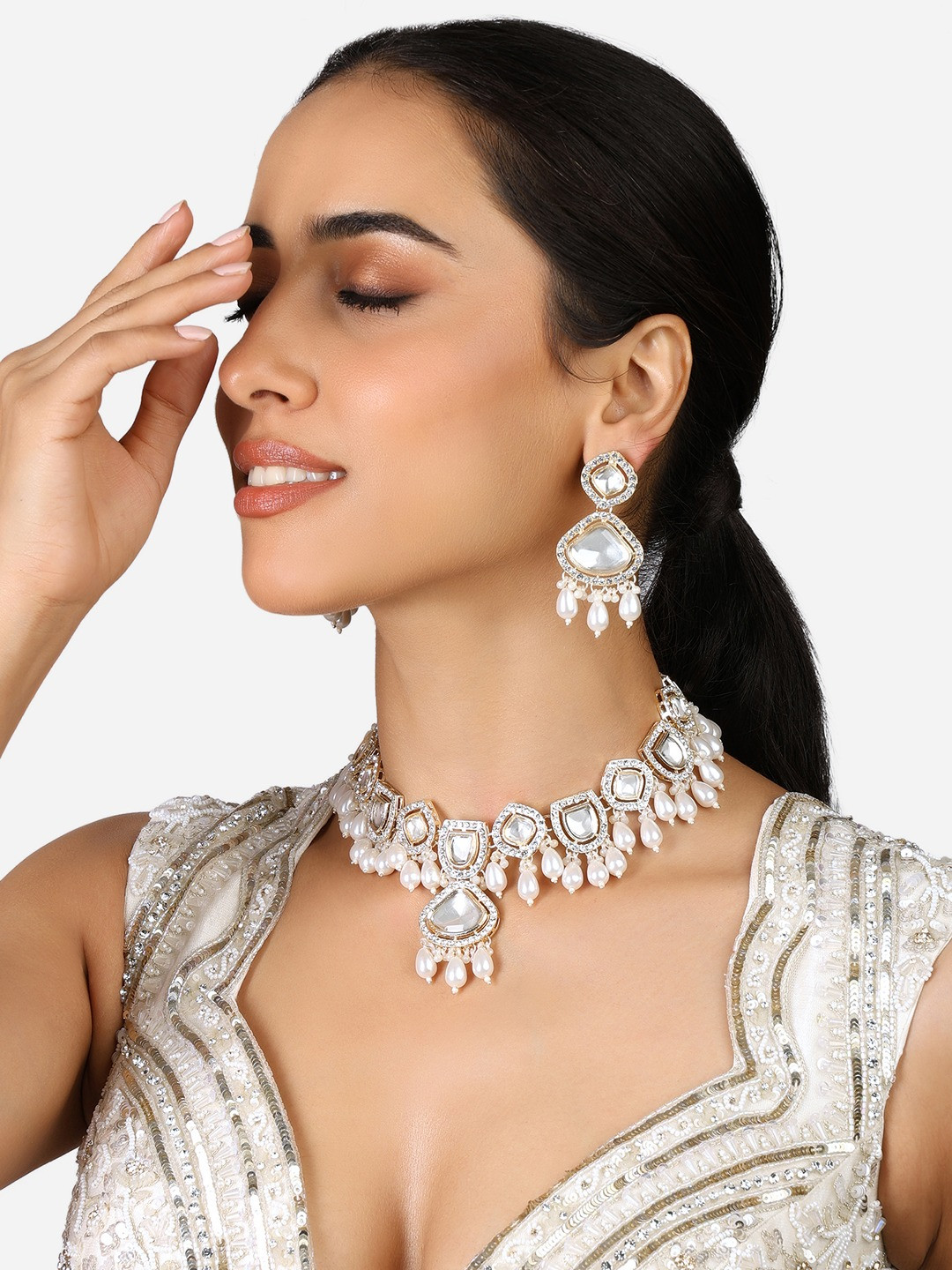 

Zaveri Pearls Gold-Plated American Diamond Studded & Beaded Jewellery Set