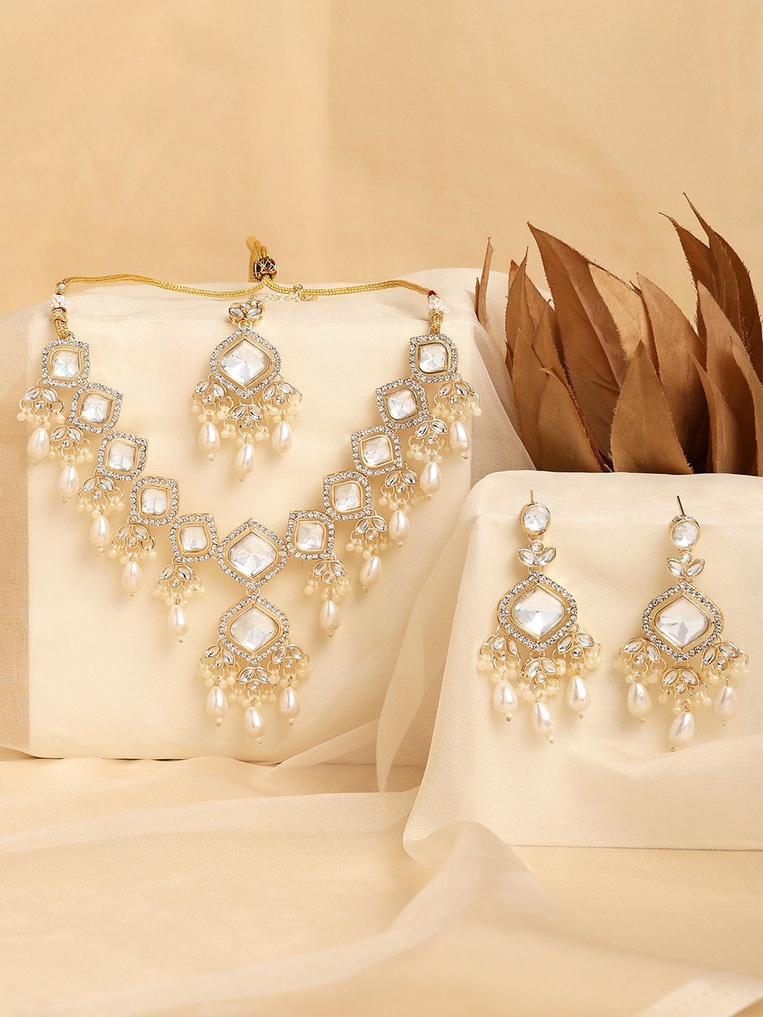 

Zaveri Pearls Gold Plated Stone Studded & Beaded Jewellery Set