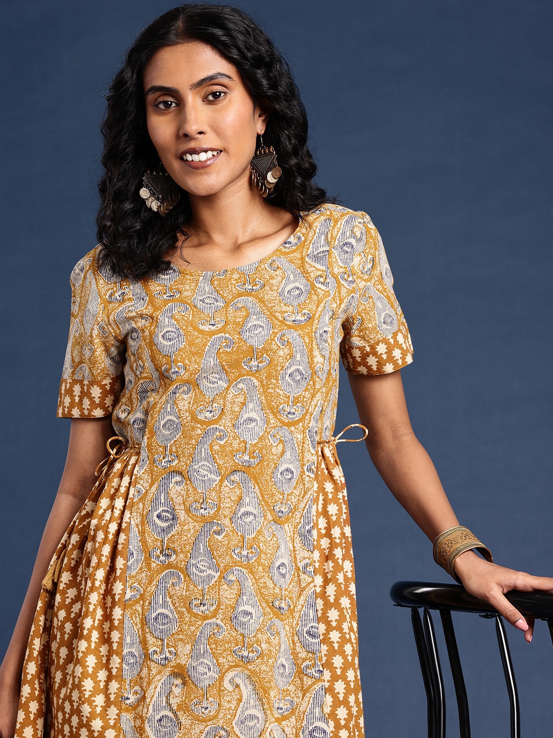 

Taavi Bagru Printed Printed A-Line Pure Cotton Ethnic Dresses, Mustard