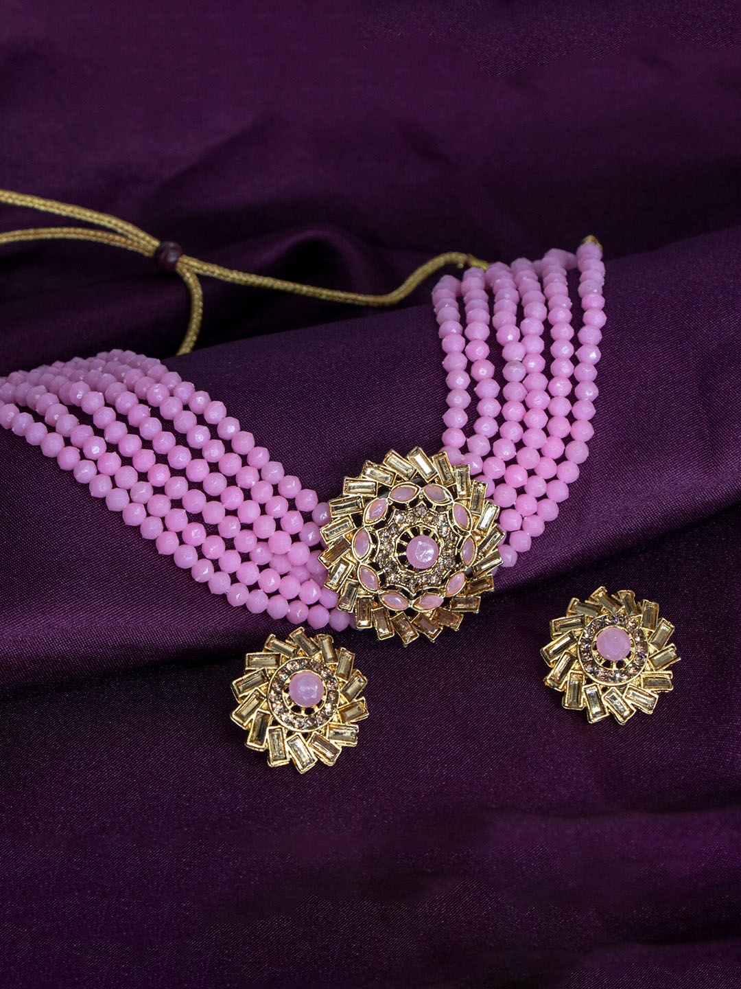 

Manikya Gold-Plated Stones Studded & Pearl Beaded Jewellery Set