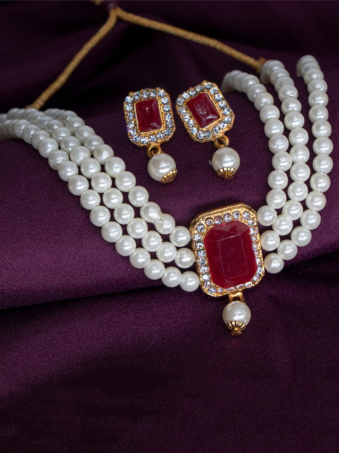 

Manikya Gold-Plated Stones Studded & Pearl Beaded Jewellery Set