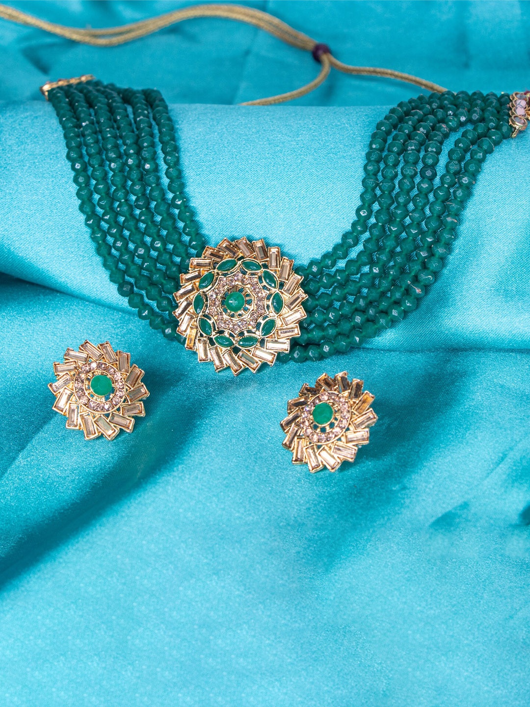 

Manikya Gold-Plated Stones Studded & Beaded Necklace And Earrings