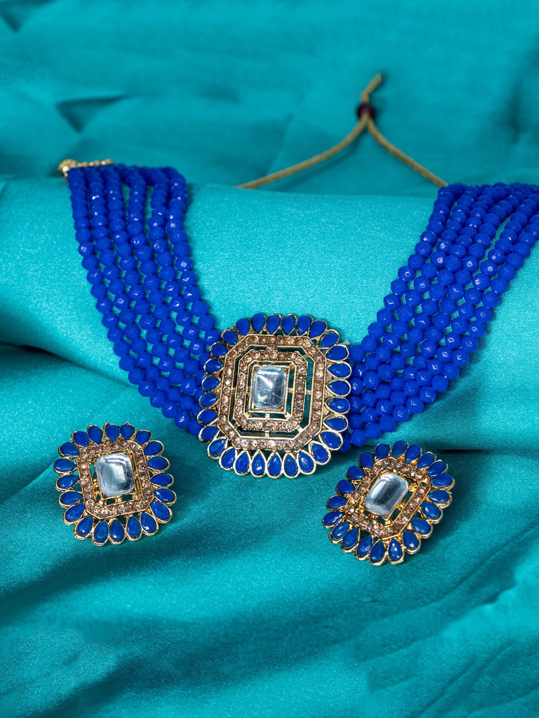 

Manikya Gold-Plated Artificial-Stones Studded & Beaded Necklace and Earrings