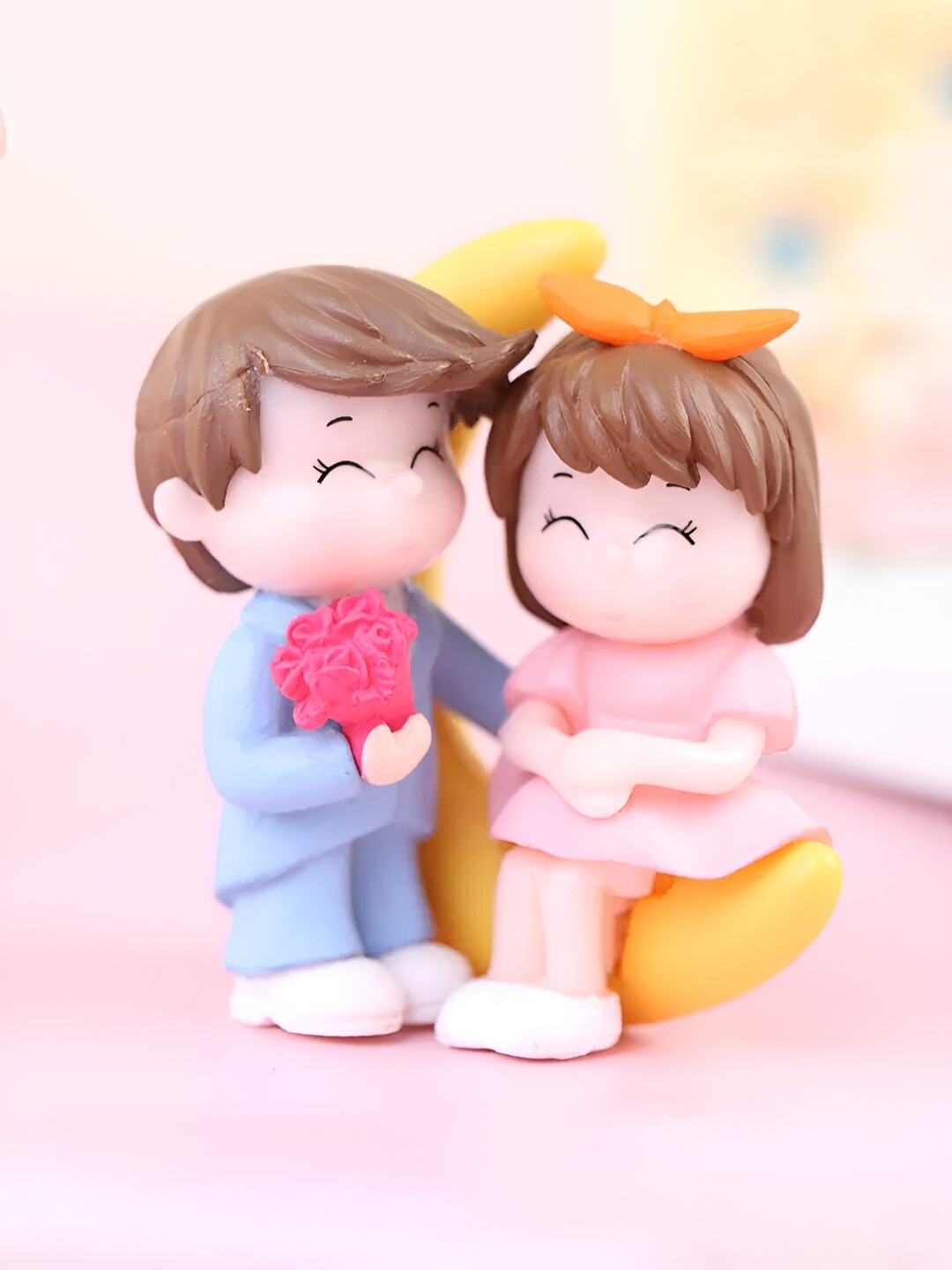 

CraftVatika Pink & Yellow Couple Figurine Showpiece