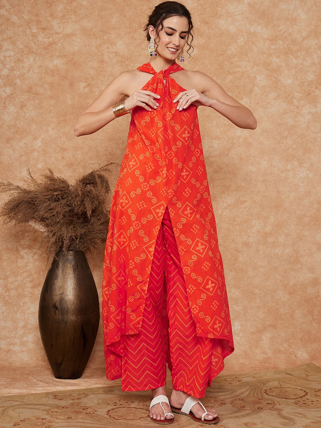 

InWeave Ethnic Motifs Printed Halter Neck Sleeveless Regular Kurta with Trouser, Orange