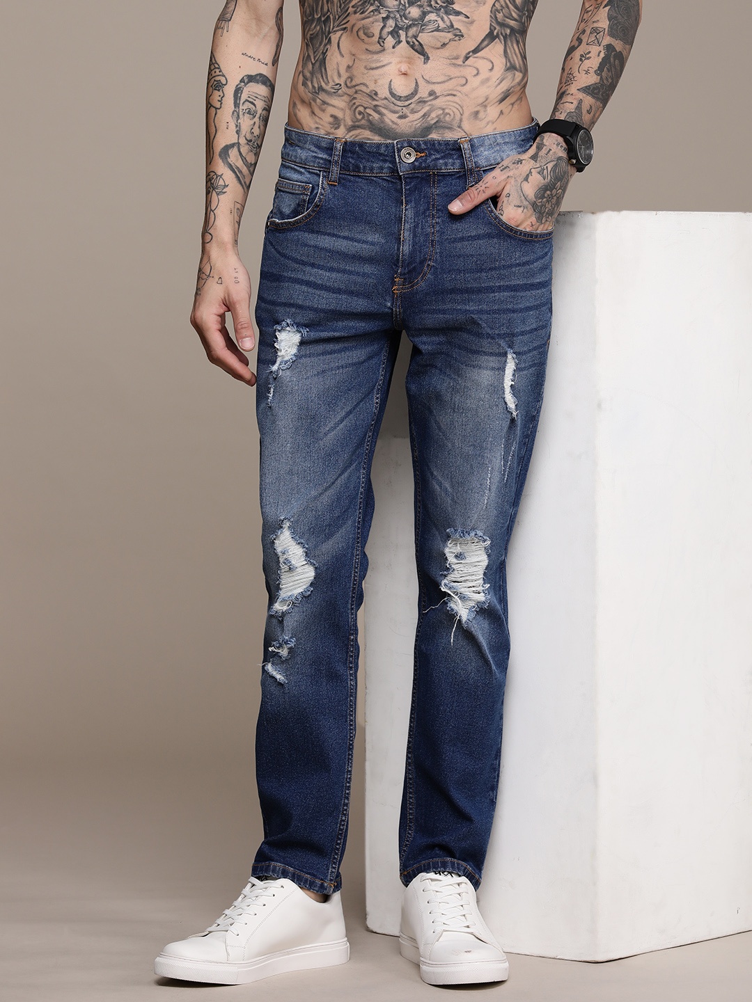 

Roadster Men Slim Fit Highly Distressed Light Fade Jeans, Blue