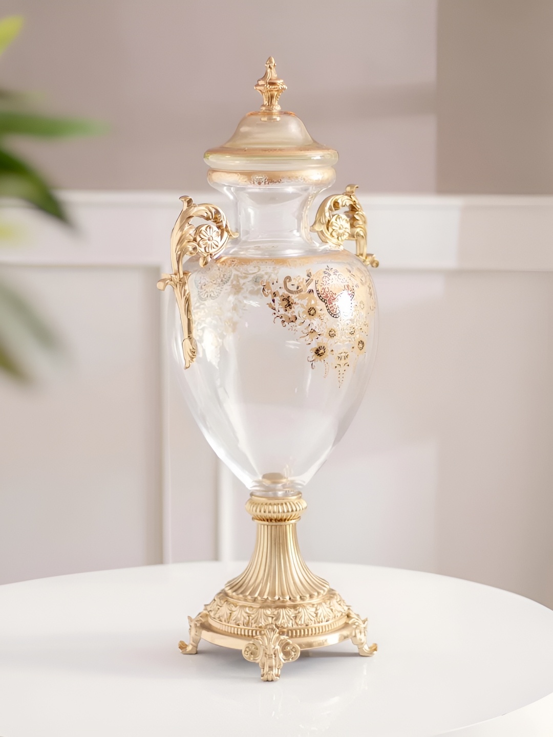 

THEDECORKART Transparent & Gold Toned Floral Printed Ornate Shape Glass Vase With Lid
