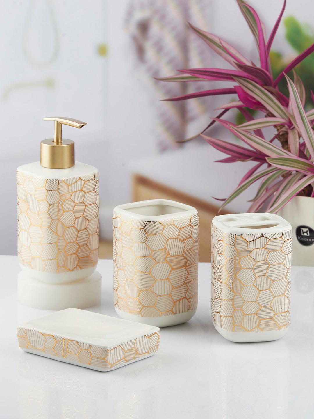 

Kookee White & Gold Toned 4 piece Geometric Printed Ceramic Bath Accessories Set